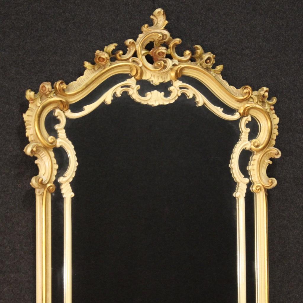 Console with mirror, Italy, second half of the 20th century. Furniture in richly carved, lacquered and gilded wood in Louis XV style complete with original marble top. Mirror of large size and impact resting for a long time on the marble top, to be