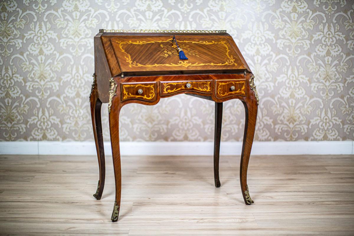 20th-Century Richy Inlaid Ladies Secretary Desk in the Louis XV Type

We present you a ladies secretary desk, whose size resembles that of Louis XV furniture.
It was manufactured before 1939.
This piece of furniture is placed on high, bent legs and