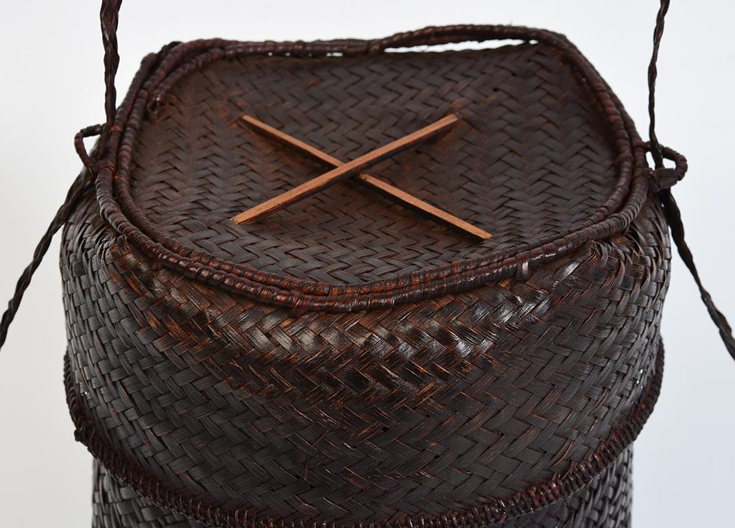 Laos bamboo basket with cover.

Age: Laos, 20th century
Size: Height 20.5 C.M. / Width 16.5 C.M.
Condition: Nice condition overall.