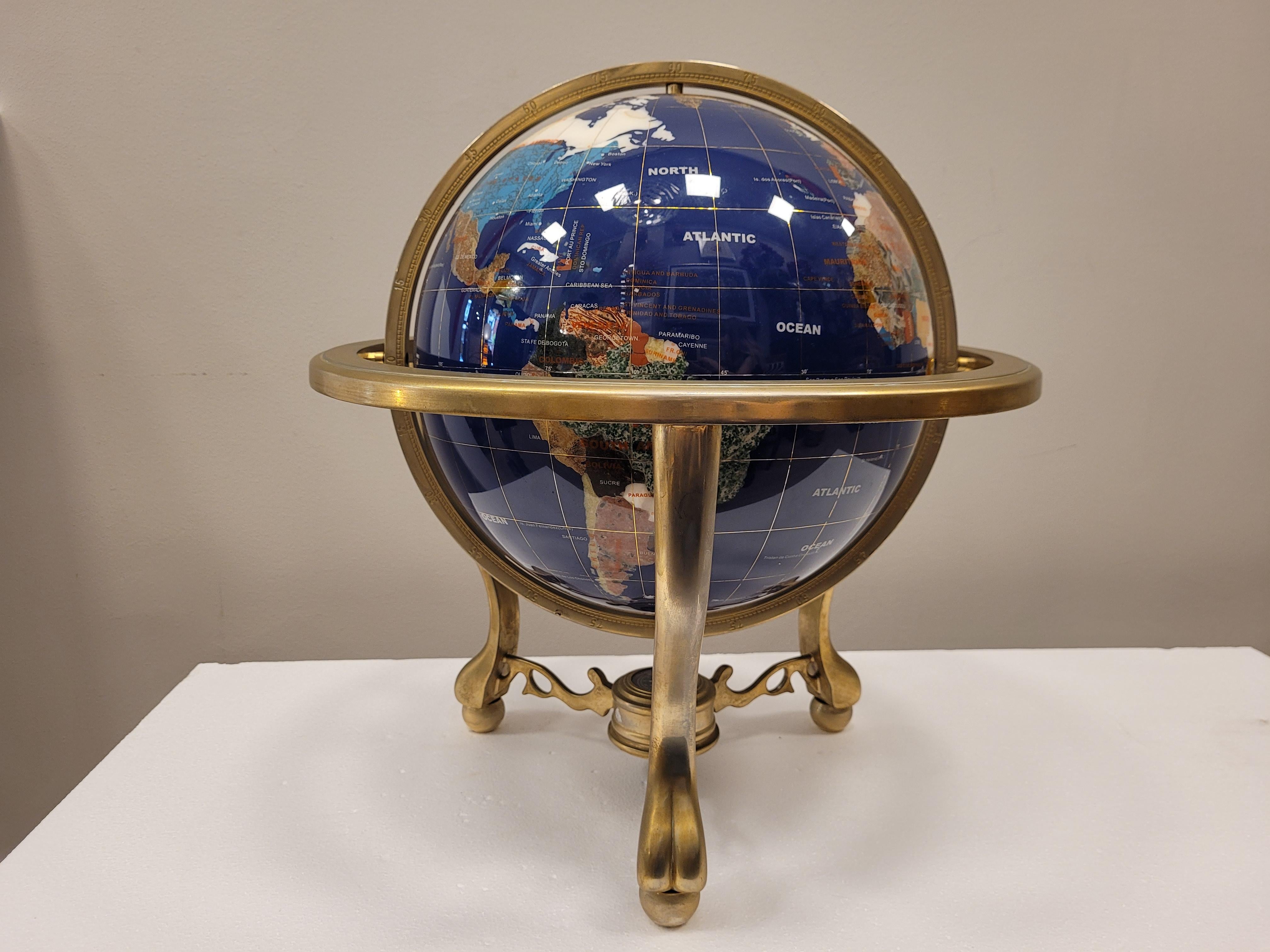 Amazing Large handmade earth globe with lapis lazuli background and marquetry with semi-precious stones, they are applied following the jewelry technique called 