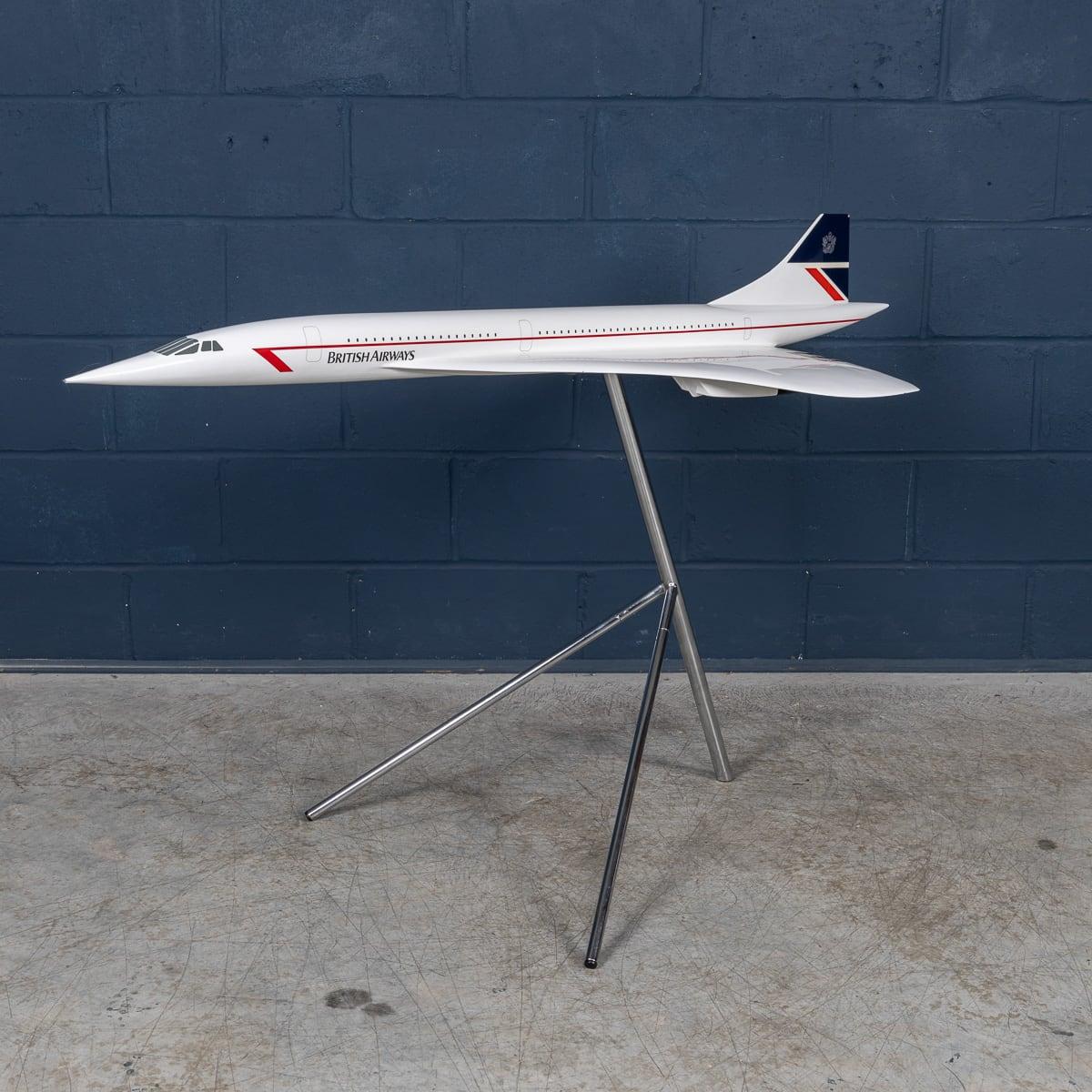 A splendid vintage fibreglass and plastic composite model of a Concorde in full British Airways livery mounted on a tripod stand by Space Models, circa 1990. This 1:36 scale aircraft model would have been presented to one of BA's top travel agents