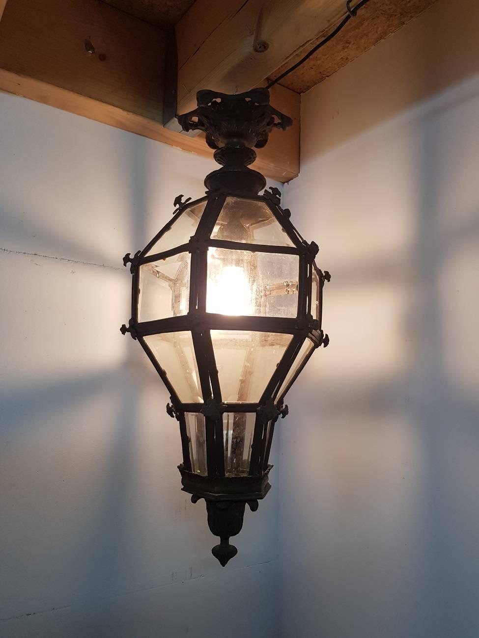 Large and heavy bronze lantern from the 20th century with facet cut glass and in the middle a door to replace the lamp.

The measurements are,
Depth 35 cm/ 13.7 inch.
Width 35 cm/ 13.7 inch.
Height 77 cm/ 30.3 inch.
 