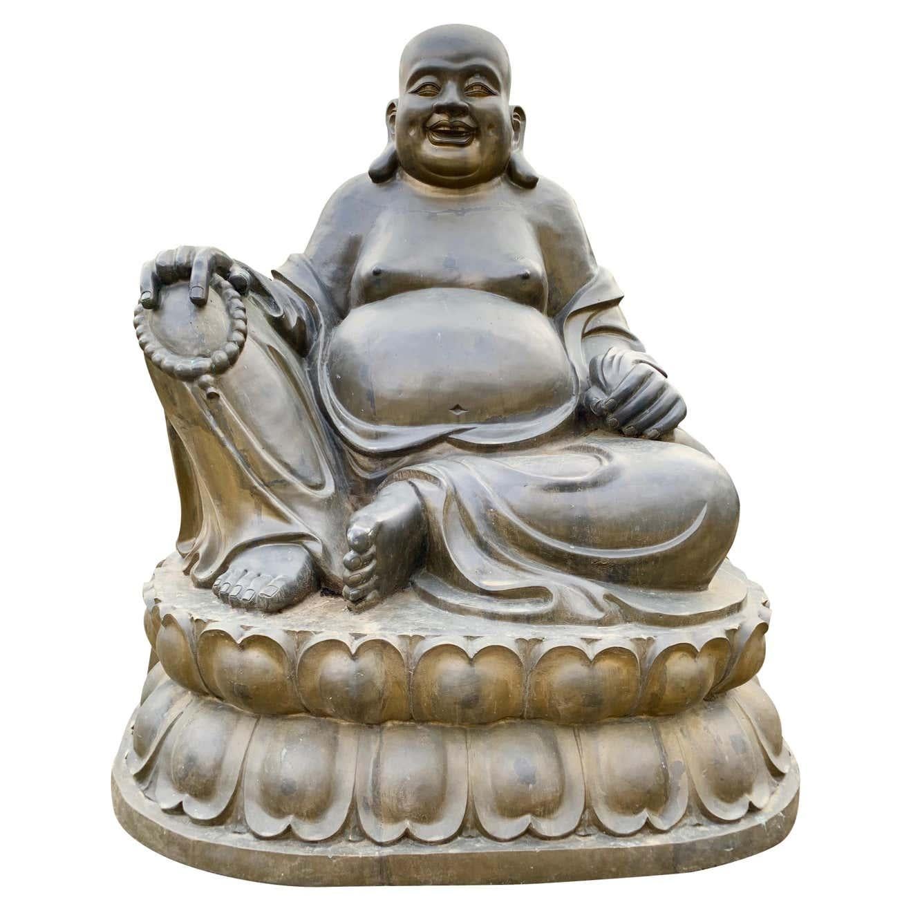 A large 20th century bronze laughing Budai originally from the New York apartment of John Legend, an American singer and songwriter. Budai, Hotei or Pu-Tai is a semi-historical monk as well as deity who was introduced into the Japanese Buddhist