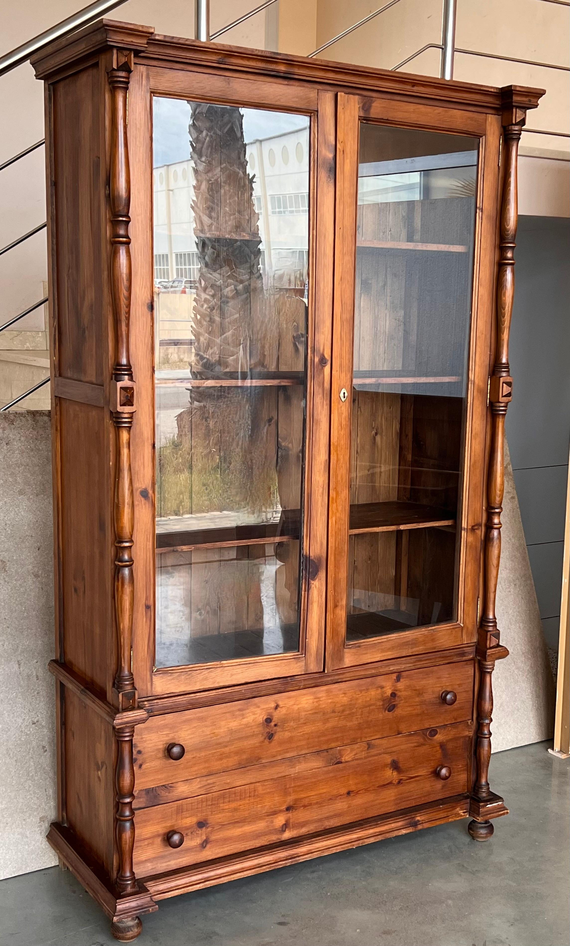 19th century Spanish cupboard or bookcase with glass vitrine, constructed from a pine called 