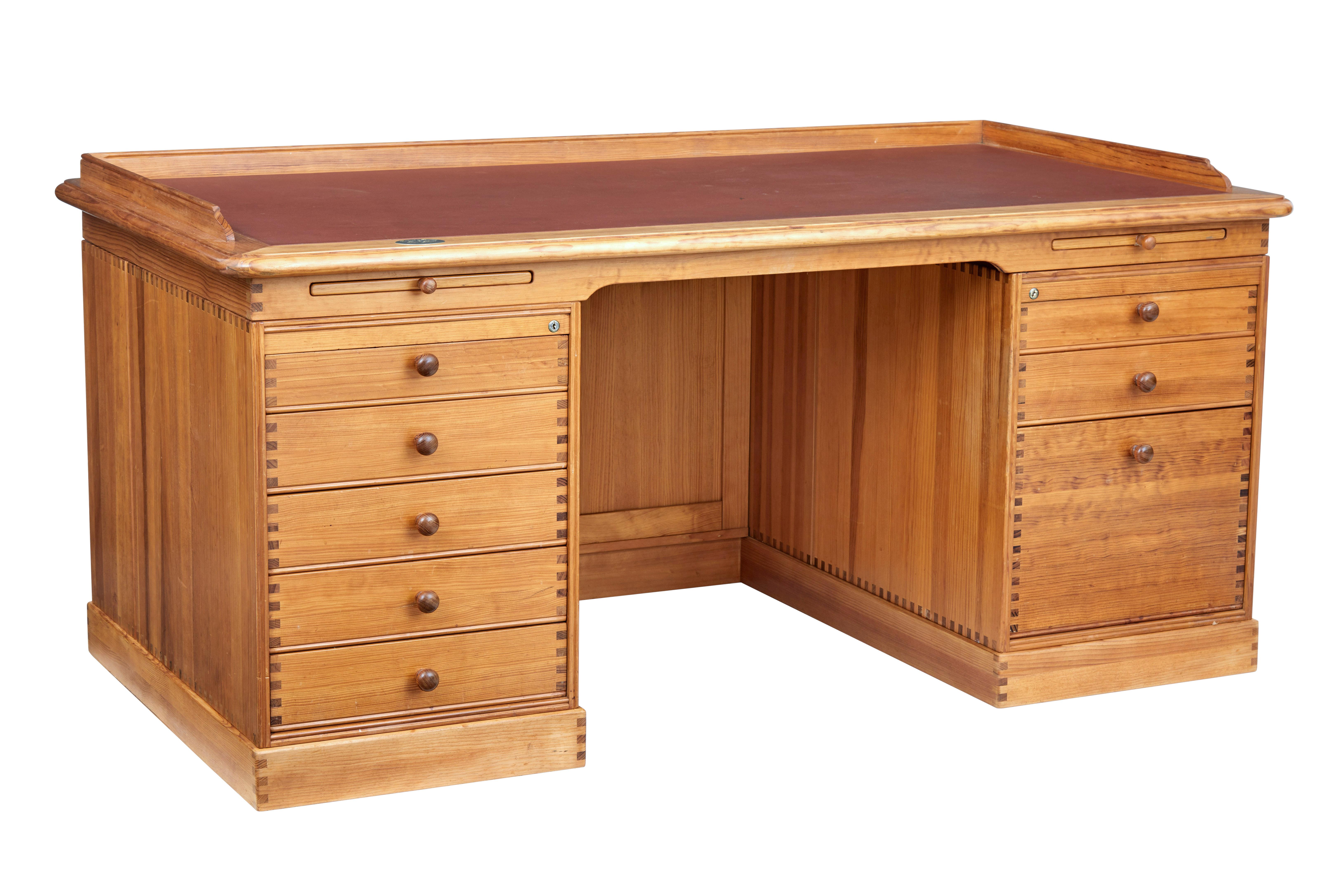 Large pine desk designed by Finn N Hansen, made by Hadsten Traeindustri of Denmark, circa 1992.

These desks were specially made with a brass plaque showing the customers name, ours baring the name of Johannes Skjaerris.

Desk comprises of 5
