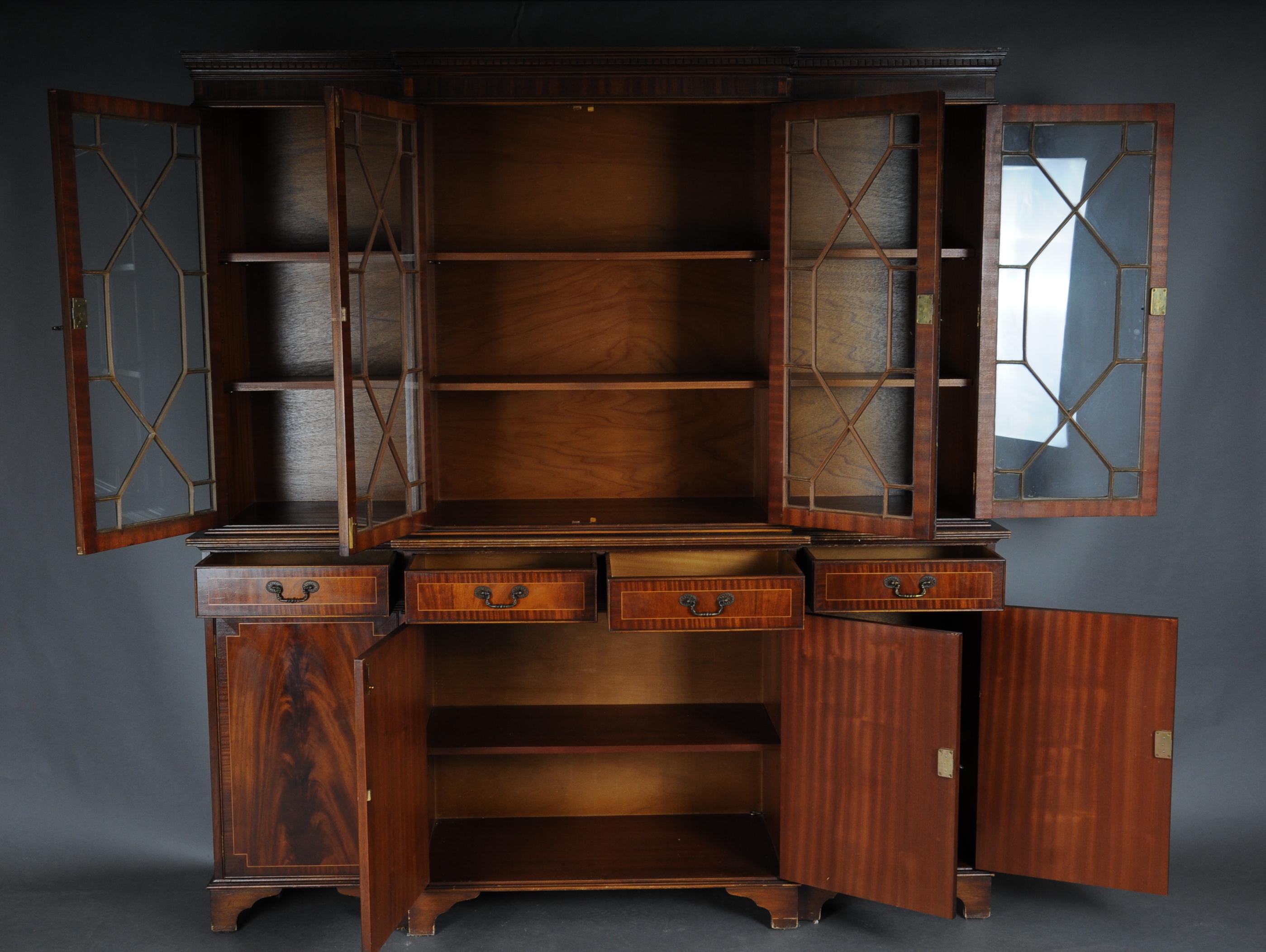 20th century large mahogany English library/ showcase

Solid wood with mahogany veneered body. 4-door lower part with slightly recessed rung glazed top + 4 drawers.

(O-256).