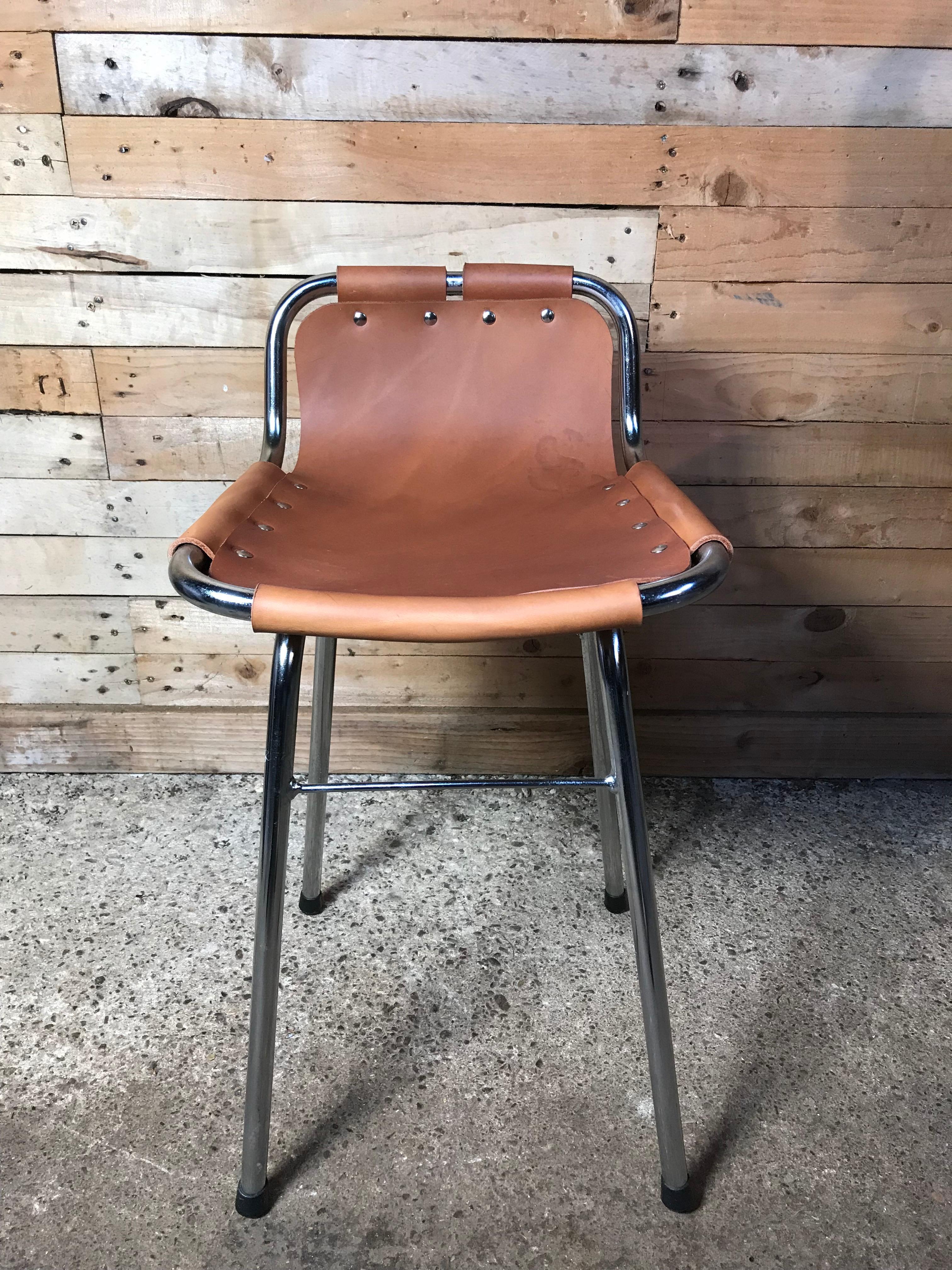 Designed by Charlotte Perriand for and used in the Ski Resort Les Arcs, circa 1960. These chairs were commissioned to be made by Cassina, one of the best Italian furniture makers and the only manufacturer of this authentic Charlotte Perriand stool.