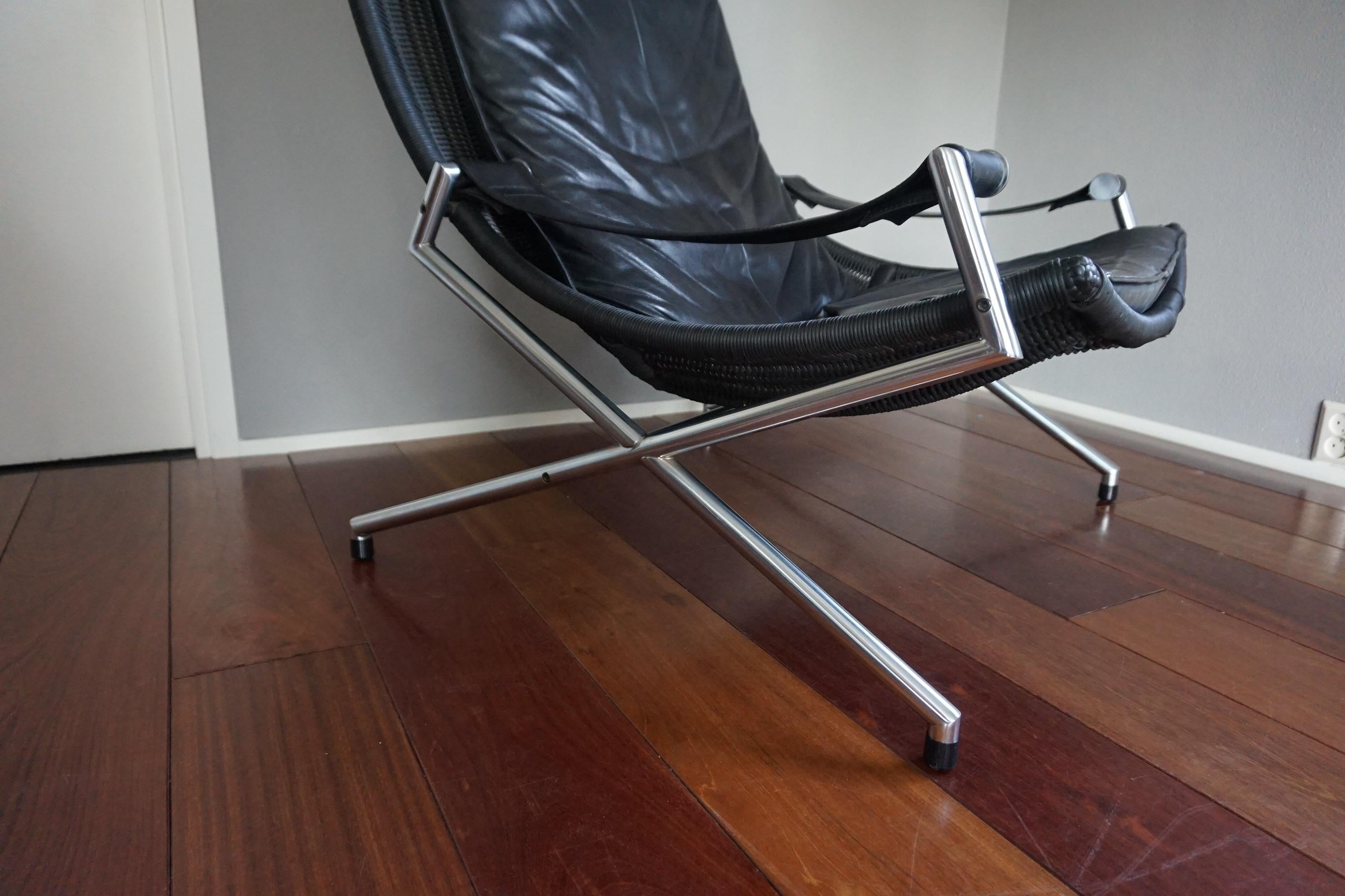 Large and modern lounge chair in chromed metal and black leather by Gerard Van Den Berg for Rohé, Netherlands.

If you are looking for a comfortable, stylish and great looking chair and you don't mind it not being perfect then this quality chair