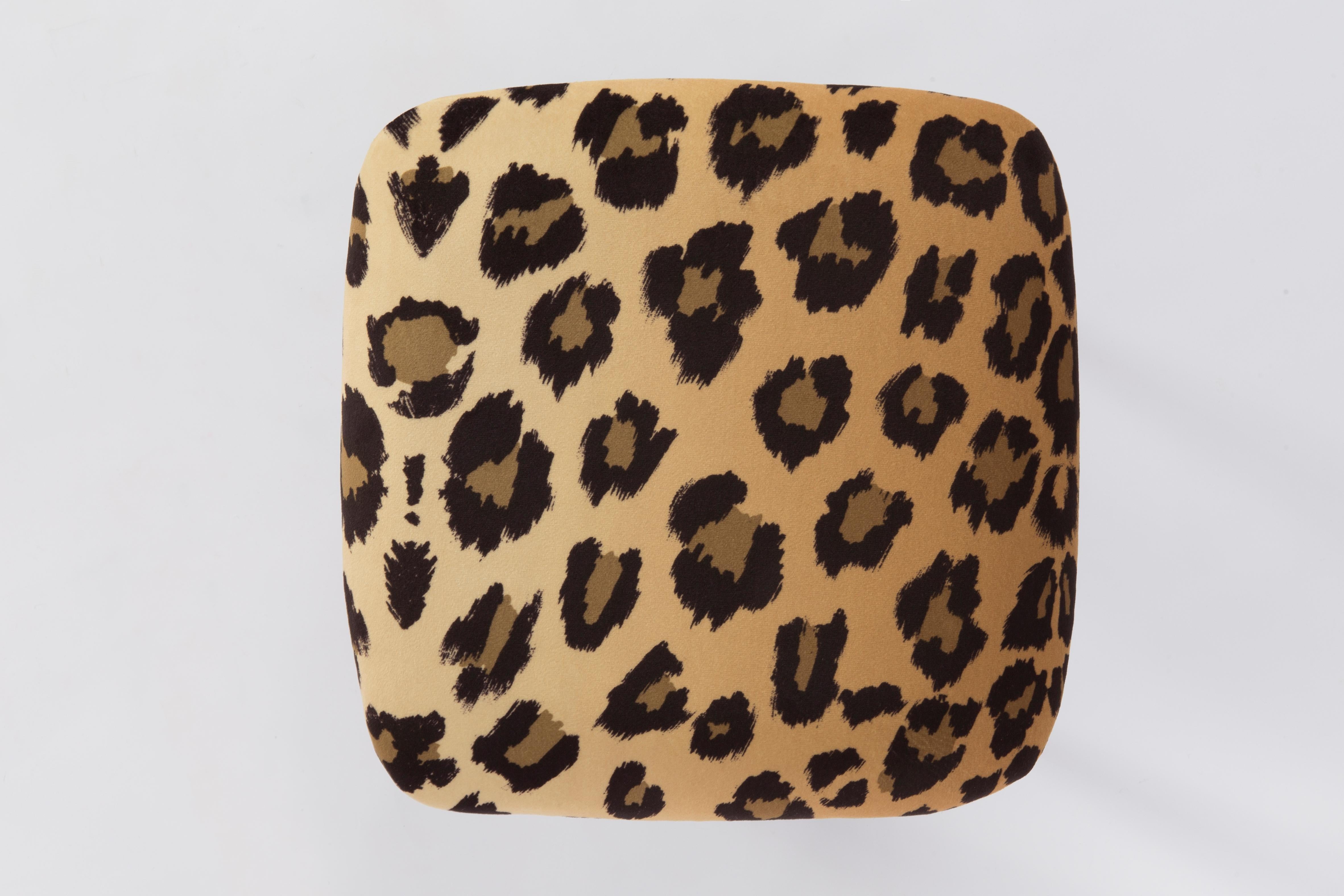 Stool from the turn of the 1960s and 1970s. Beautiful soft velvet leopard print upholstery. The stool consists of an upholstered part, a seat and wooden legs narrowing downwards, characteristic of the 1960s style.