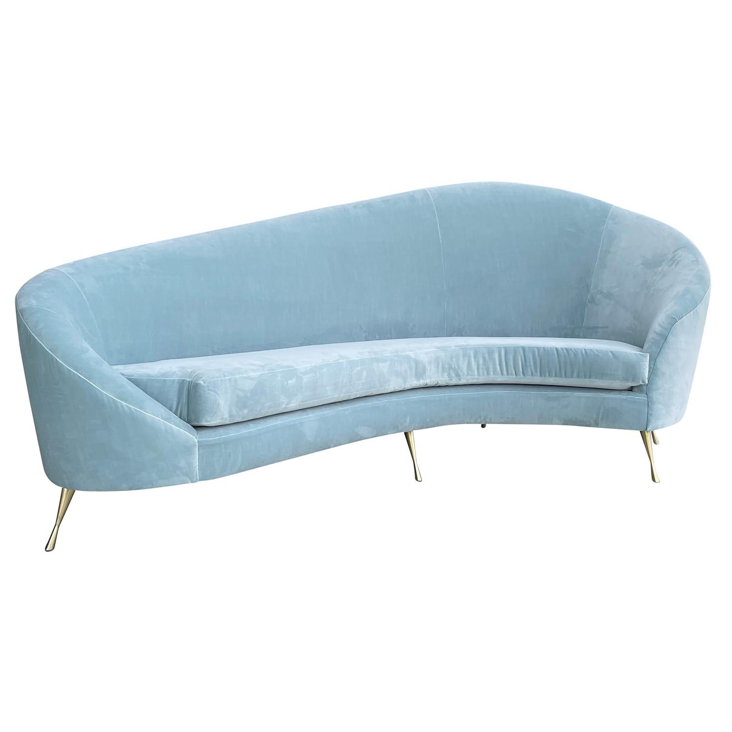 A large, half rounded vintage Mid-Century Modern Italian upholstered three four sofa, canapé designed by Federico Munari in good condition. The seat backrest of the divano is slightly curved with gently outstretched arms, standing on six curved