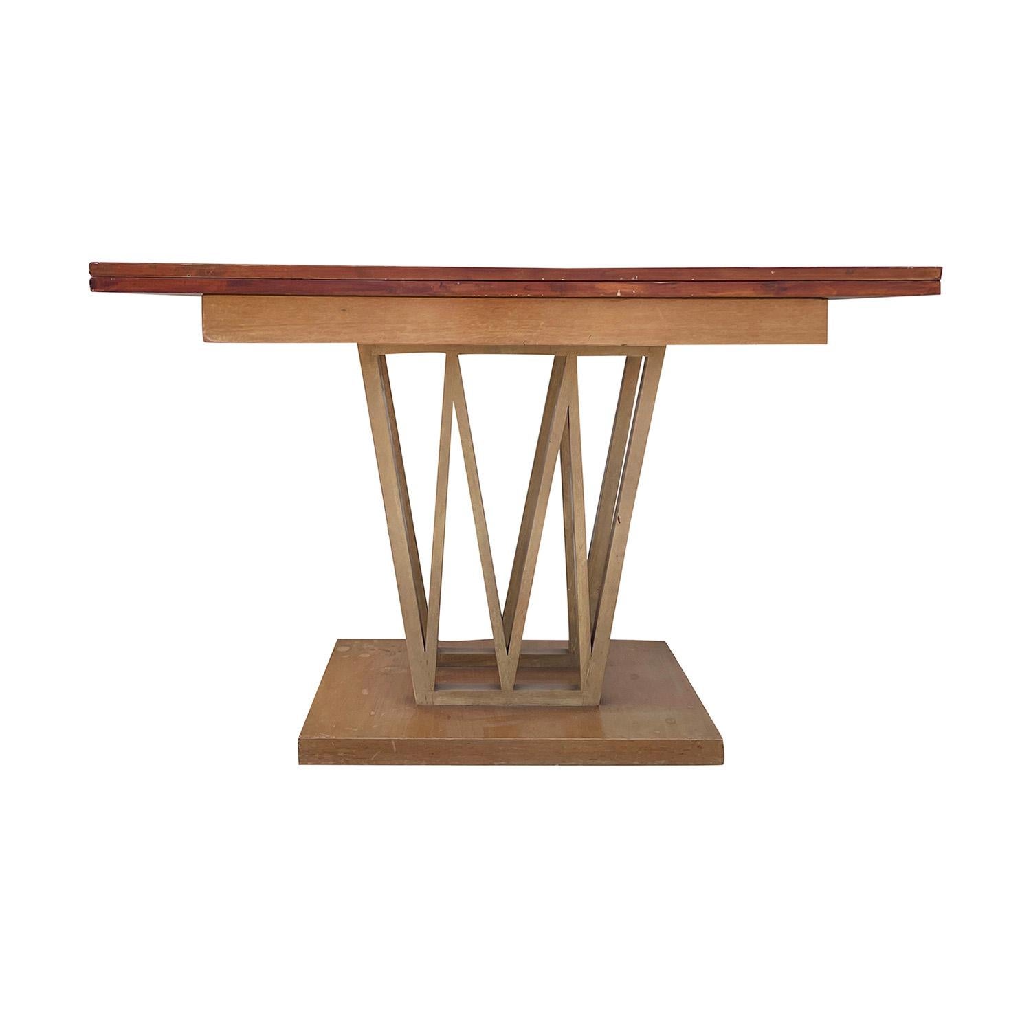 A small, vintage Mid-Century Modern Danish drop leaf dining table made of hand crafted polished Walnut, in good condition. The light-brown folding top was designed by an unknown carpenter from Copenhagen. The end table is standing on sculptural