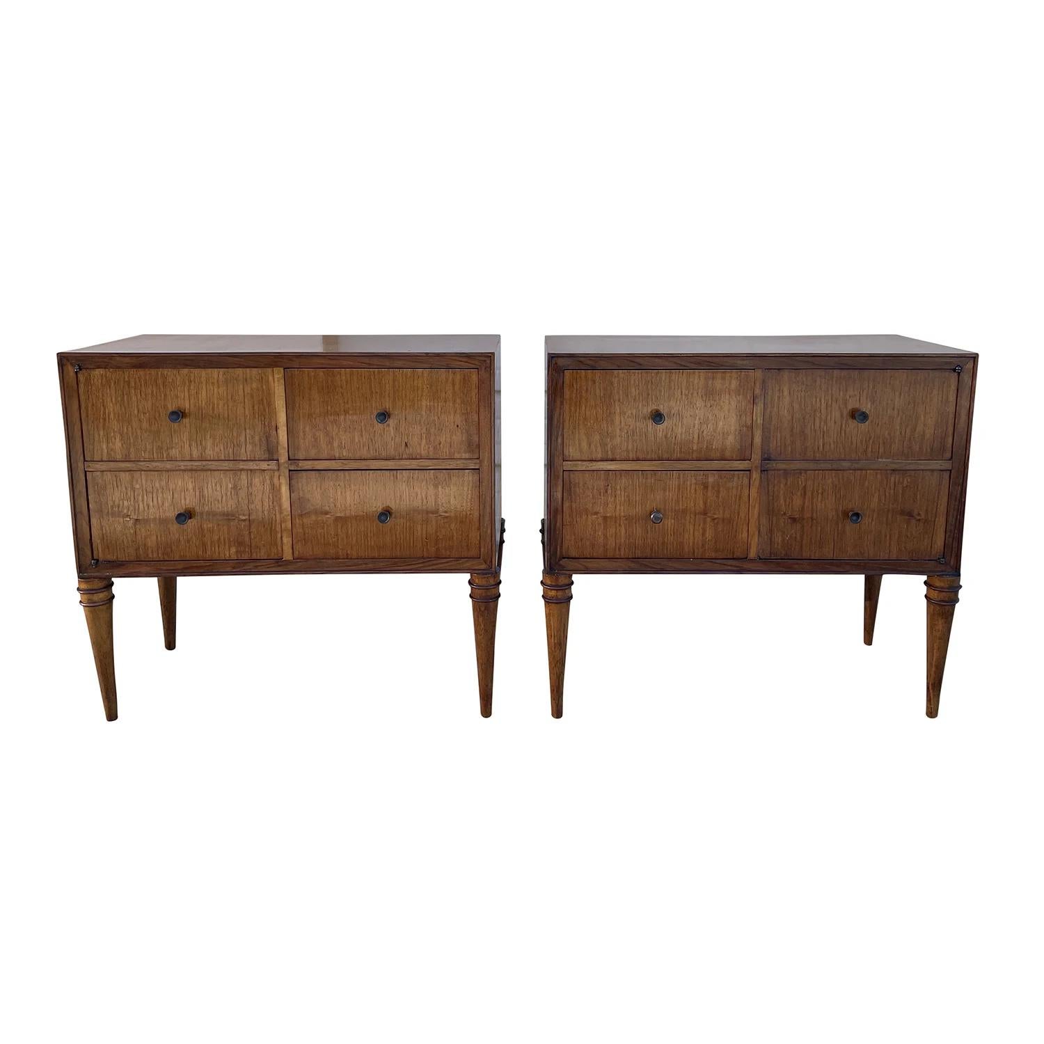 A light-brown, vintage Mid-Century Modern Italian pair of tall nightstands, bedside tables made of hand carved polished walnut, each of them is composed with four drawers and metal handles, pulls. Designed by Tomaso Buzzi in good condition. The