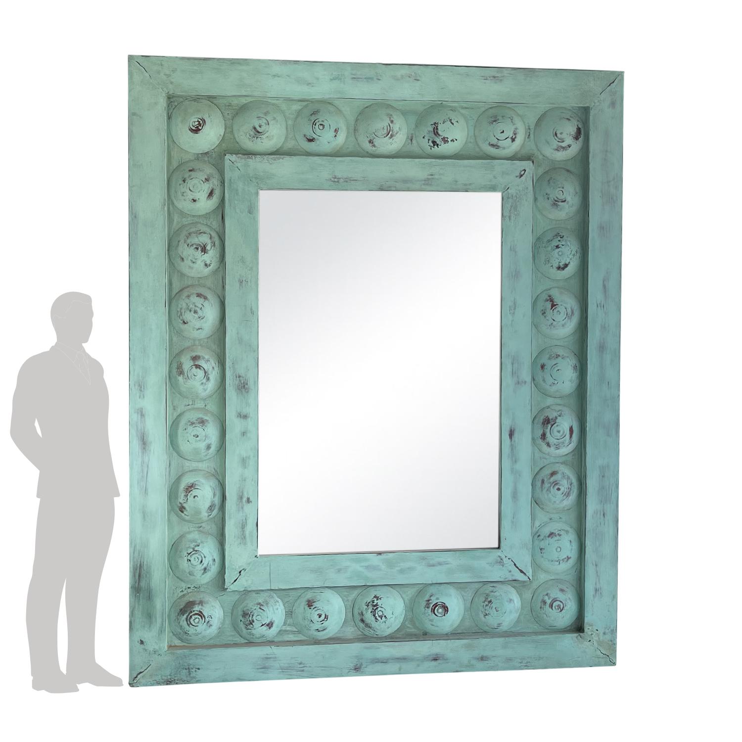 An oversized large copper mirror with a wide frame, vert de gris finish and newly inserted mirror glass. The front of the mirror is original and mounted on a refurbished back. Wear consistent with age and use, circa early 20th century, Prov. Ile De