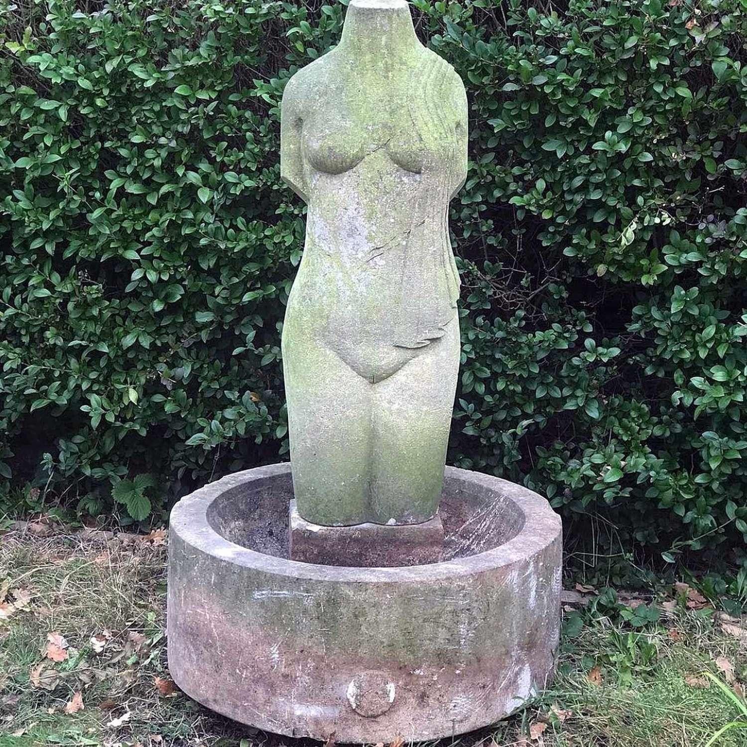 As a stand a lone sculpture in your garden this is quite the piece, but now imagine it with all the bird life coming to bath and have a drink.

1960's Carved stone semi draped female torso and base with sculptors monogram to the rear of the