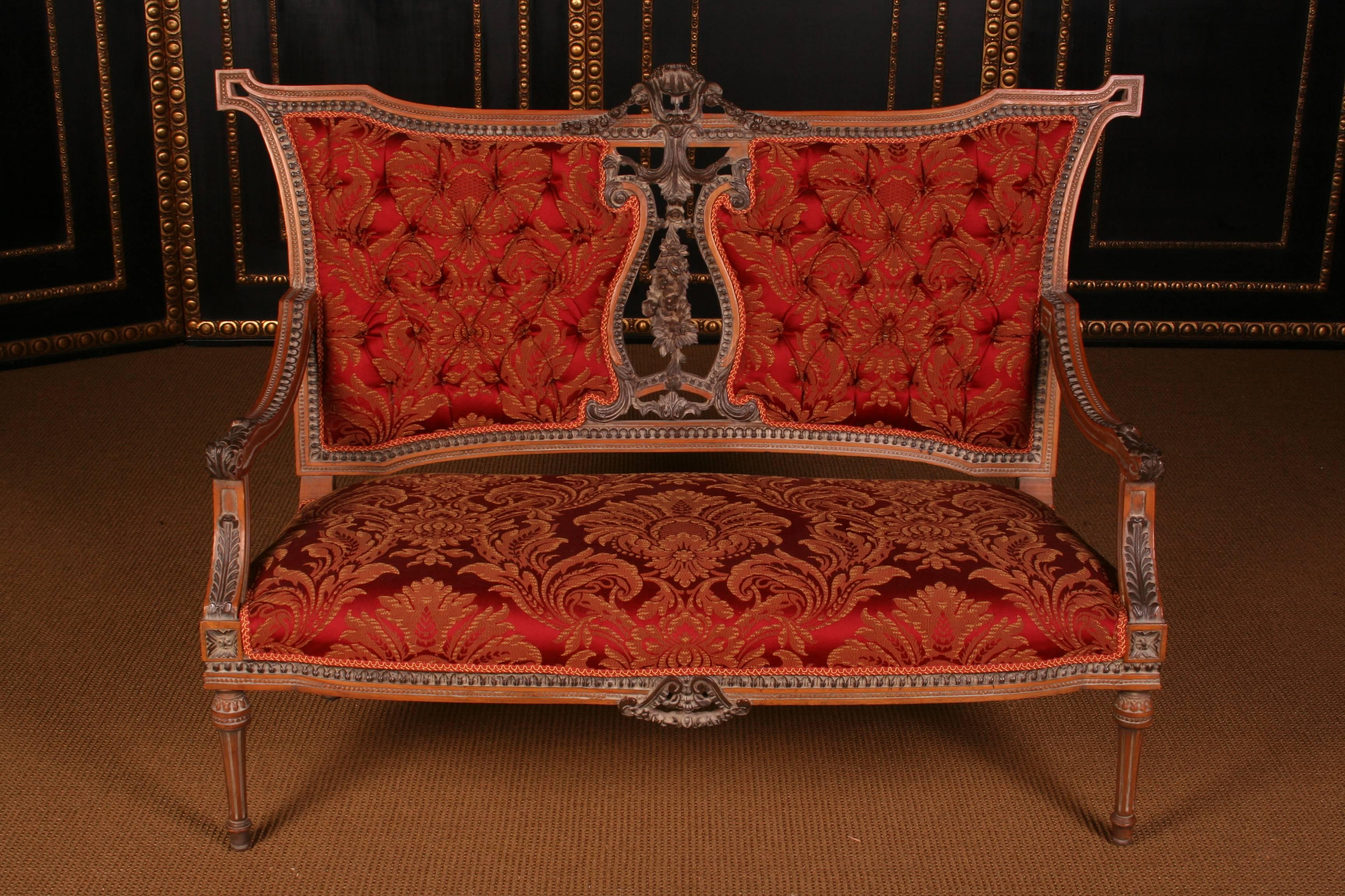 An elegant French garniture in Louis 16th style.
Solid beechwood, finely carved and edged.

Measurements:
Sofa: Height 101 cm, length 133 cm, depth 62 cm
Armchair: Width 64 cm, height 101 cm, depth 62 cm

(B-Dom-65).