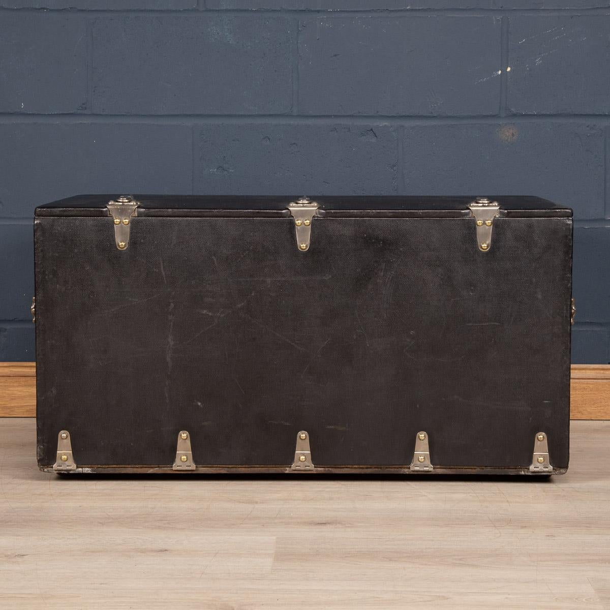 Antique 20th century large and very rare Louis Vuitton car trunk covered in black Vuittonite canvas. Car trunks were usually bespoke made for the owner’s car and would ordinarily be positioned inside the boot of the vehicle or strapped to the back