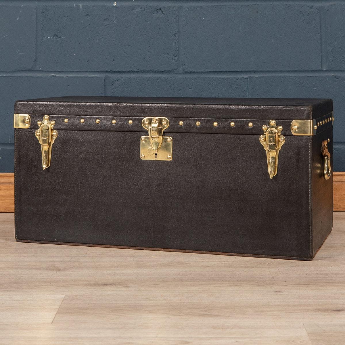 A large and very rare Louis Vuitton car trunk covered in black Vuittonite canvas. Car trunks were usually bespoke made for the owner’s car and would ordinarily be positioned inside the boot of the vehicle or strapped to the back of the vehicle. As