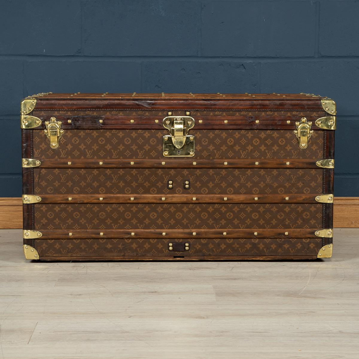 Stunning early 20th century Louis Vuitton trunk was the must have item of any elite traveler. Covered in the world famous LV monogrammed canvas, with its lozine borders and brass fitting it would have been the top of the line even at the time of