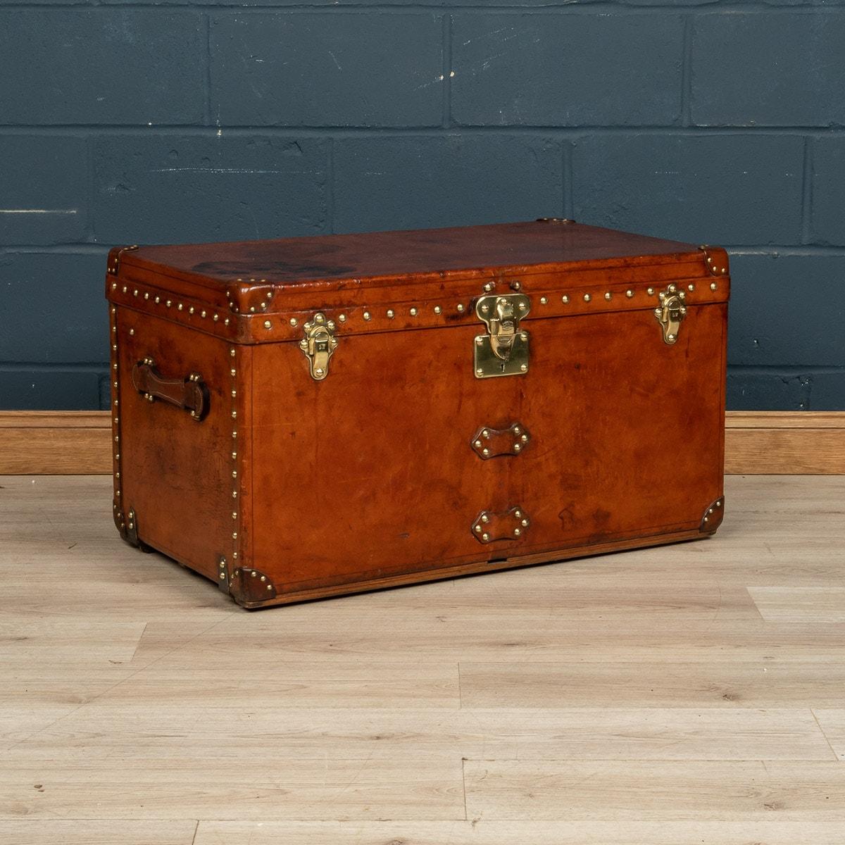 A very rare Louis Vuitton courier trunk covered in leather. Dating to the early part of the 20th century, covered not in the world famous (but more common) monogram canvas but in a single piece of cow hide. The condition inside is in near mint