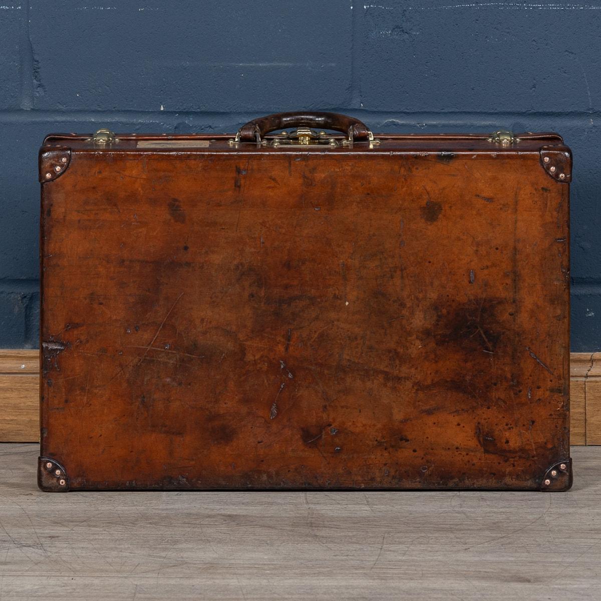 Brass 20th Century Louis Vuitton Cow Hide Suitcase, France c.1920 For Sale