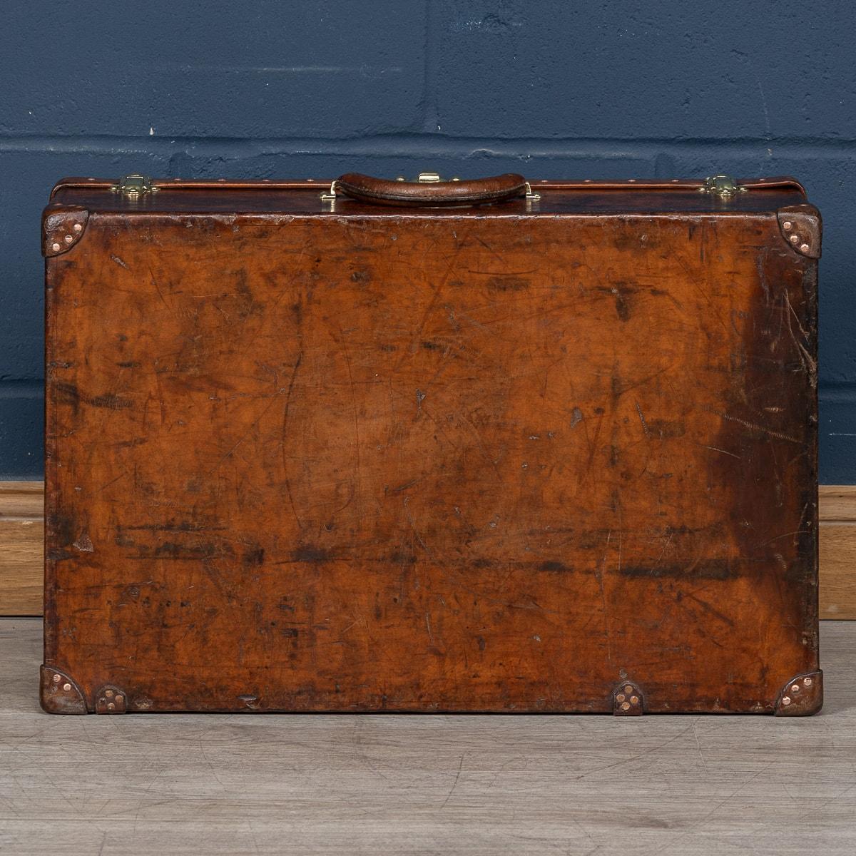 Brass 20th Century Louis Vuitton Cow Hide Suitcase, France c.1920 For Sale