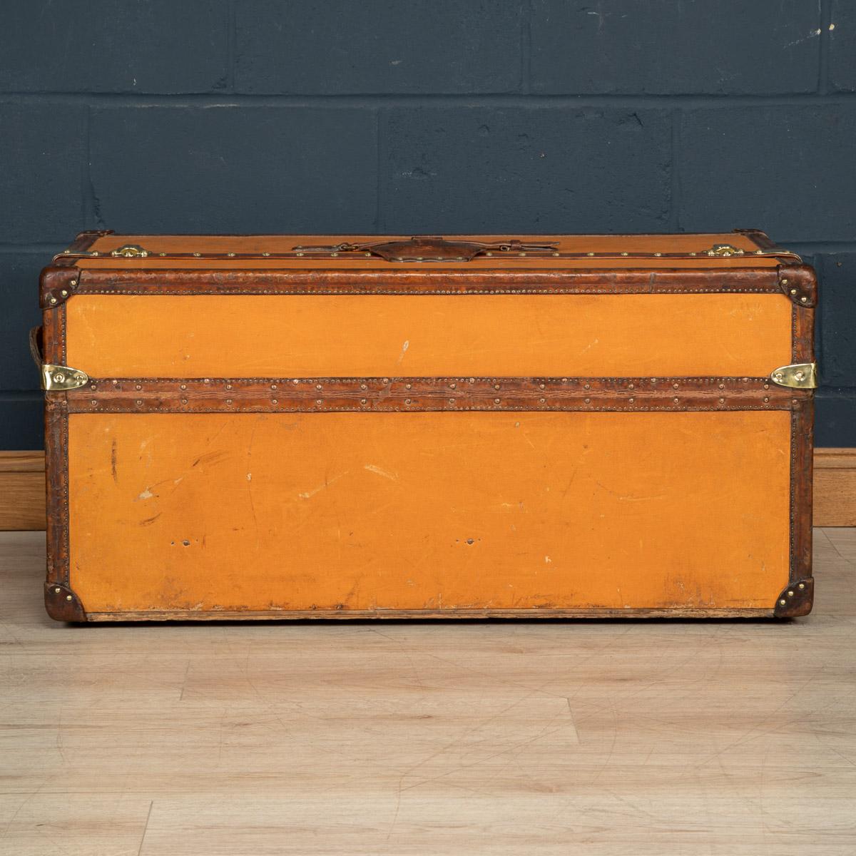 A very rare Louis Vuitton “Ideal” trunk (from French “Malle Idéale”), circa 1900's, features orange “Vuittonite“ canvas, all brass hardware, and leather trims. This model was initially introduced as the ‘Perfect Trunk’. The double-topped wardrobe