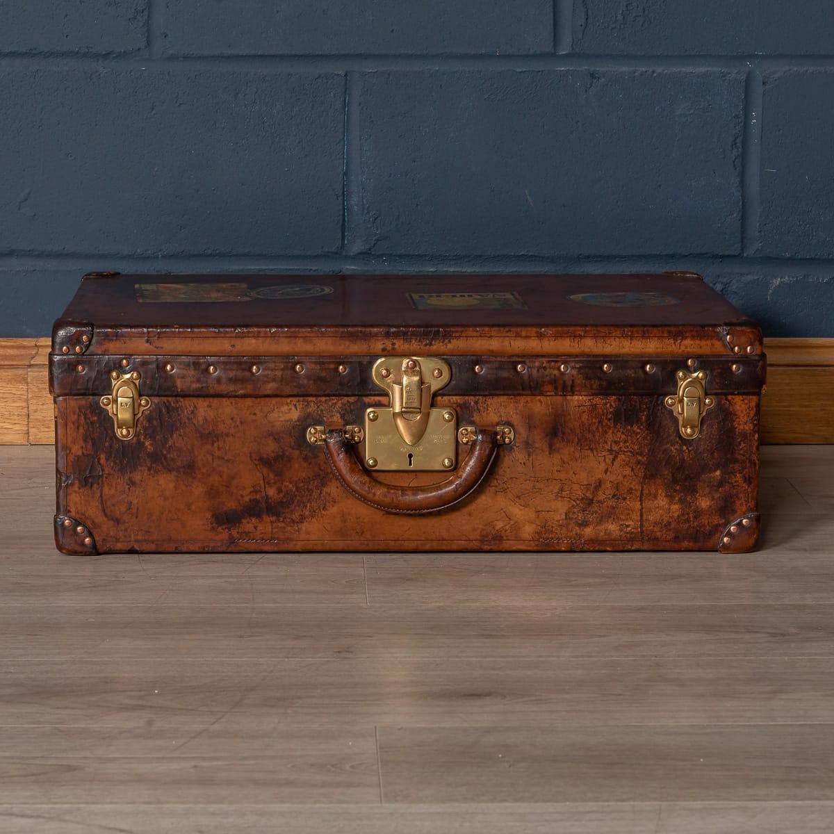 A very rare Louis Vuitton suitcase dating from the early part of the 20th century, covered not in the world famous (but more common) monogram canvas but in a single piece of cow hide. These all-leather trunks and cases were made by special order and