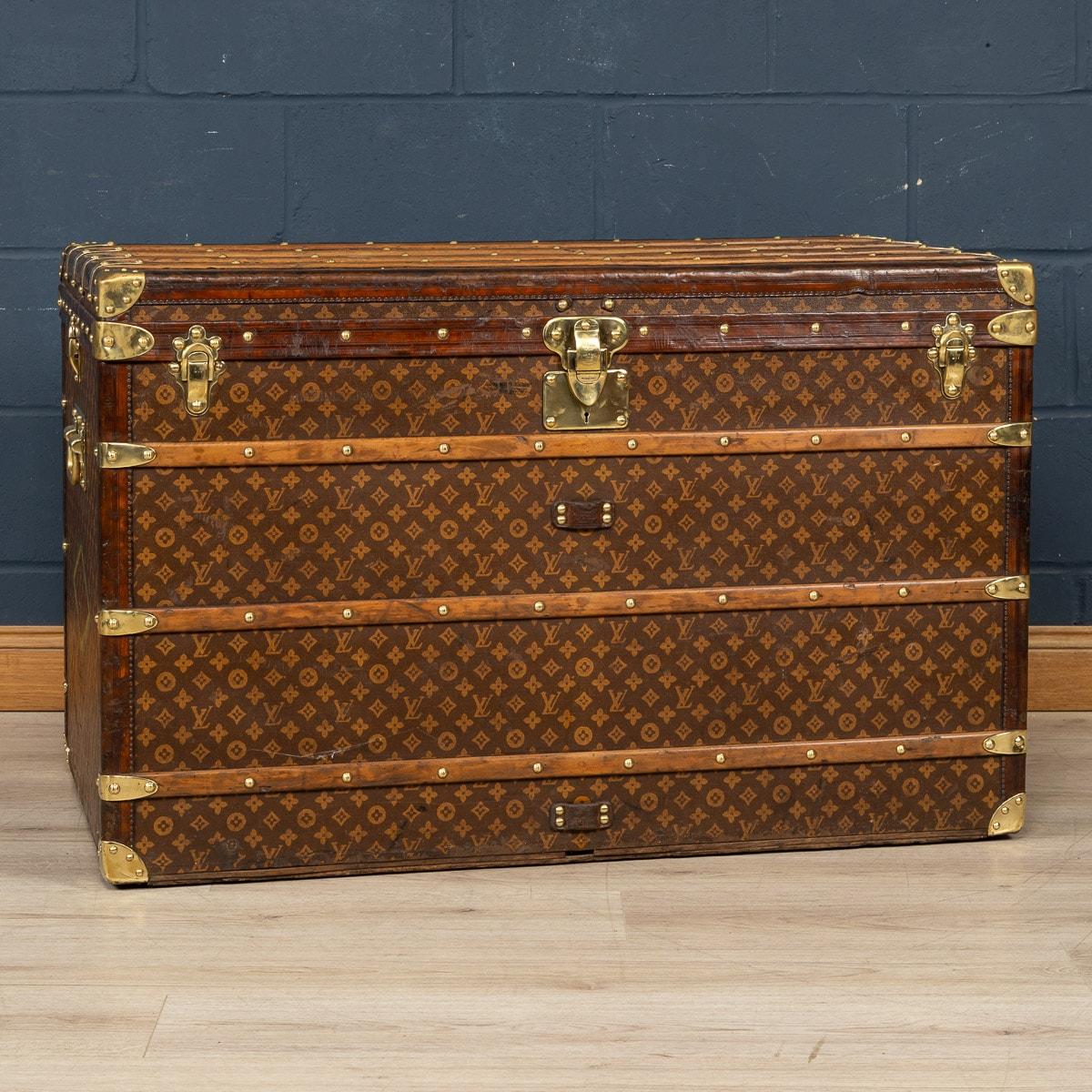 An exquisite “malle haute“ (tall trunk) by Louis Vuitton, early 20th century. The malle haute is the largest of the standard sizes, any trunk larger than this one would have been custom made. Covered in the world famous LV monogrammed canvas, with