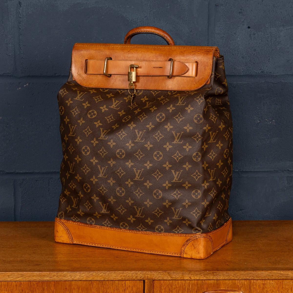 A lovely Louis Vuitton steamer travel bag in monogram canvas and natural tan leather, made in France in the latter quarter of the 20th century. Steamer bags have been produced by Louis Vuitton for over 120 years. In 1901, the company introduced the