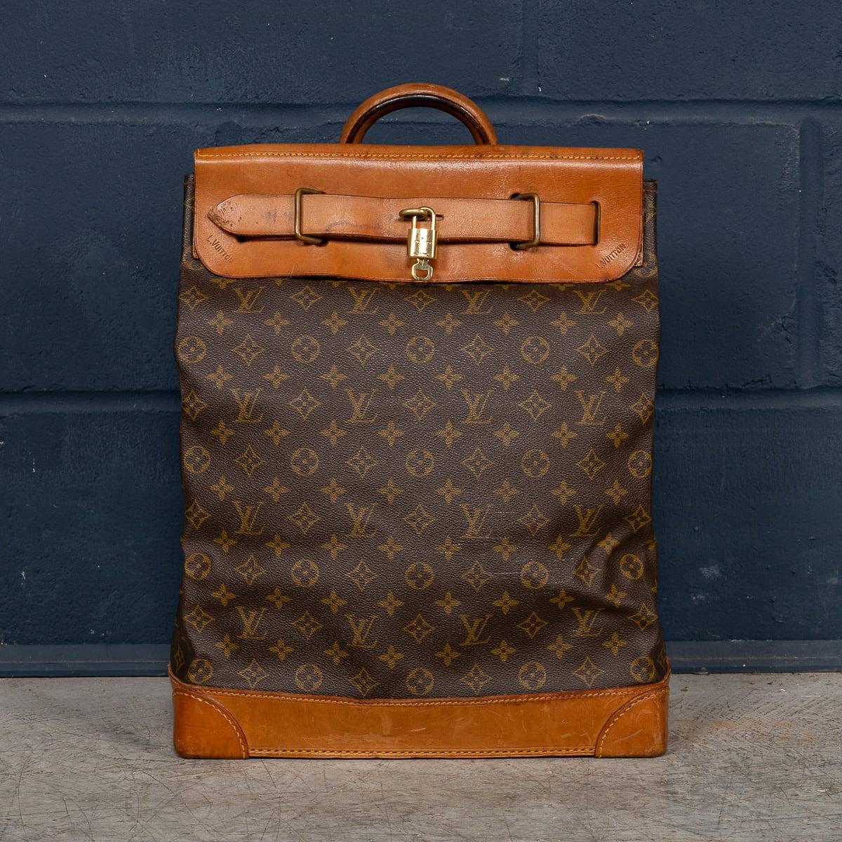 A lovely Louis Vuitton steamer travel bag in monogram canvas and natural tan leather, made in France in the latter quarter of the 20th century. Steamer bags have been produced by Louis Vuitton for over 120 years. In 1901, the company introduced the