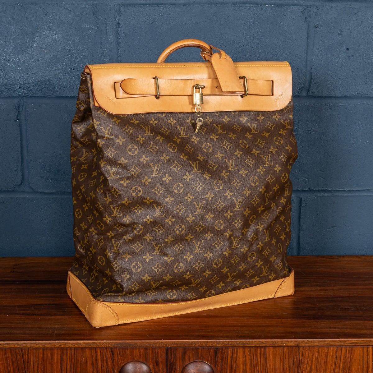 A lovely Louis Vuitton steamer travel bag in monogram canvas and natural tan leather, made in France in the latter quarter of the 20th century. Steamer bags have been produced by Louis Vuitton for over 120 years. In 1901, the company introduced the