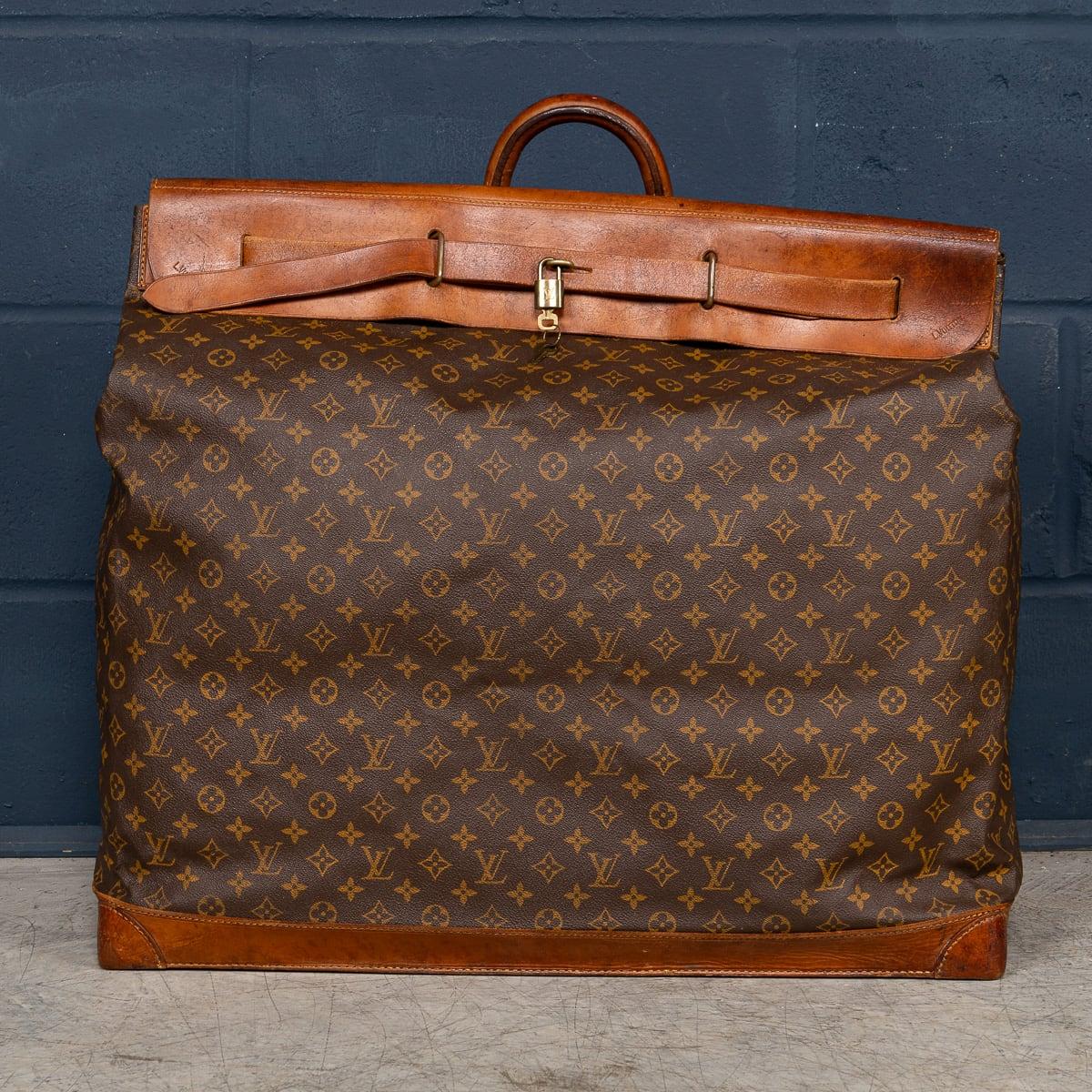 A large Louis Vuitton steamer travel bag in monogram canvas and natural tan leather, made in France in the latter quarter of the 20th century. This particular model is a massive 65cm in width, it is the largest steamer bag on the market.

Steamer