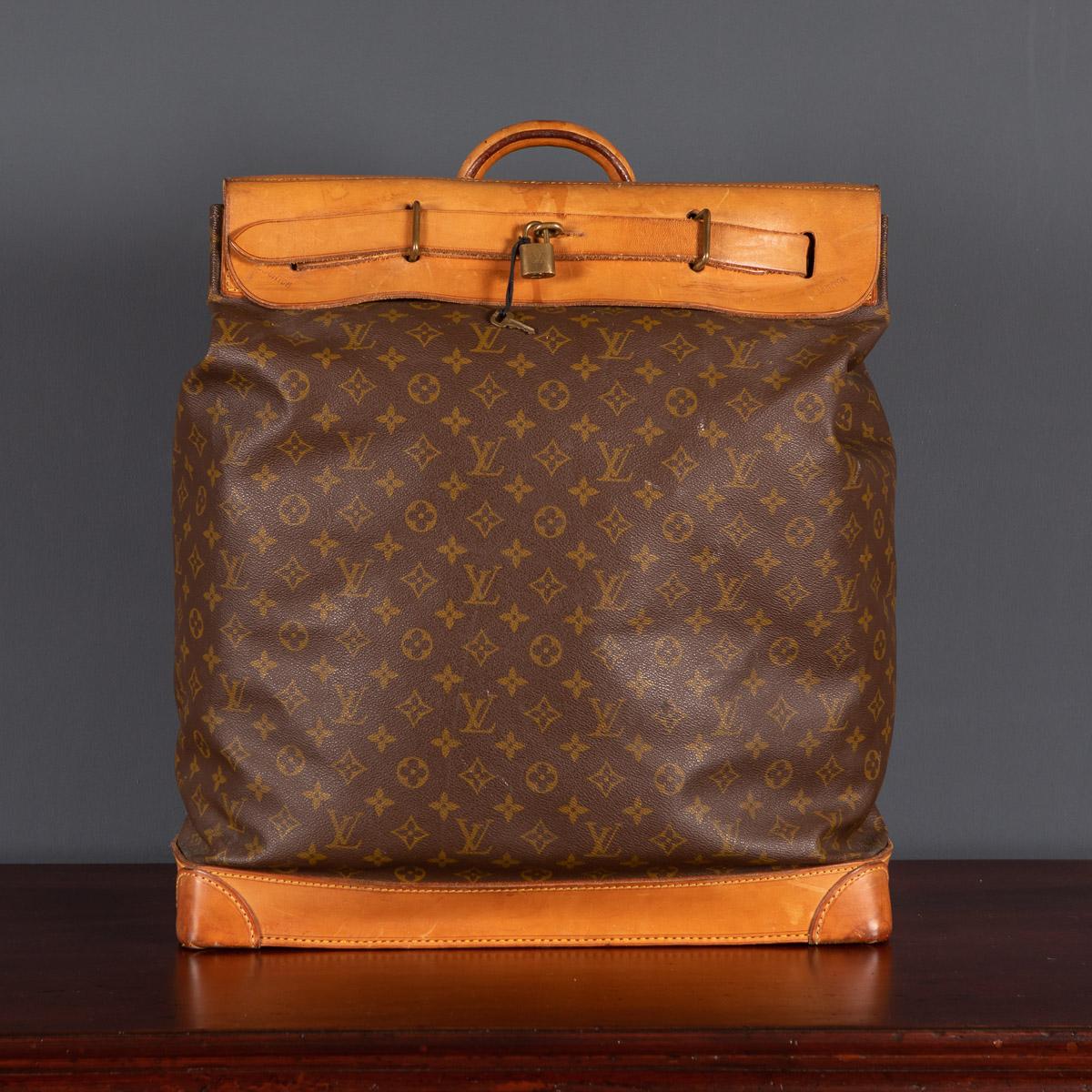 A lovely Louis Vuitton steamer travel bag in monogram canvas and natural tan leather, made in France in the latter quarter of the 20th century. Steamer bags have been produced by Louis Vuitton for over 120 years. In 1901, the company introduced the