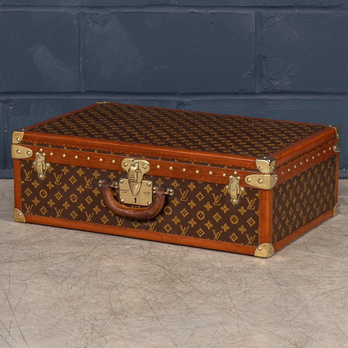A delightful Louis Vuitton hard-sided case, covered with the iconic monogram canvas and complemented by brass fittings, dating to the first half of the 20th century. The exterior exudes the unmistakable style that has become synonymous with the