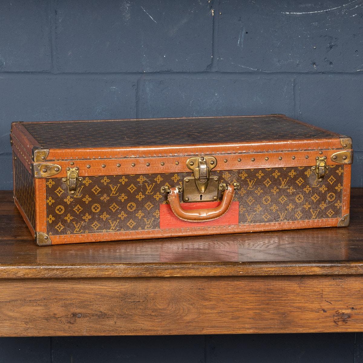 A charming Louis Vuitton hard-sided case, mid 20th century, the exterior finished in the famous monogram canvas with brass fittings. A great piece for use today or as an item for the home.

CONDITION
In overall fair vintage condition, handle