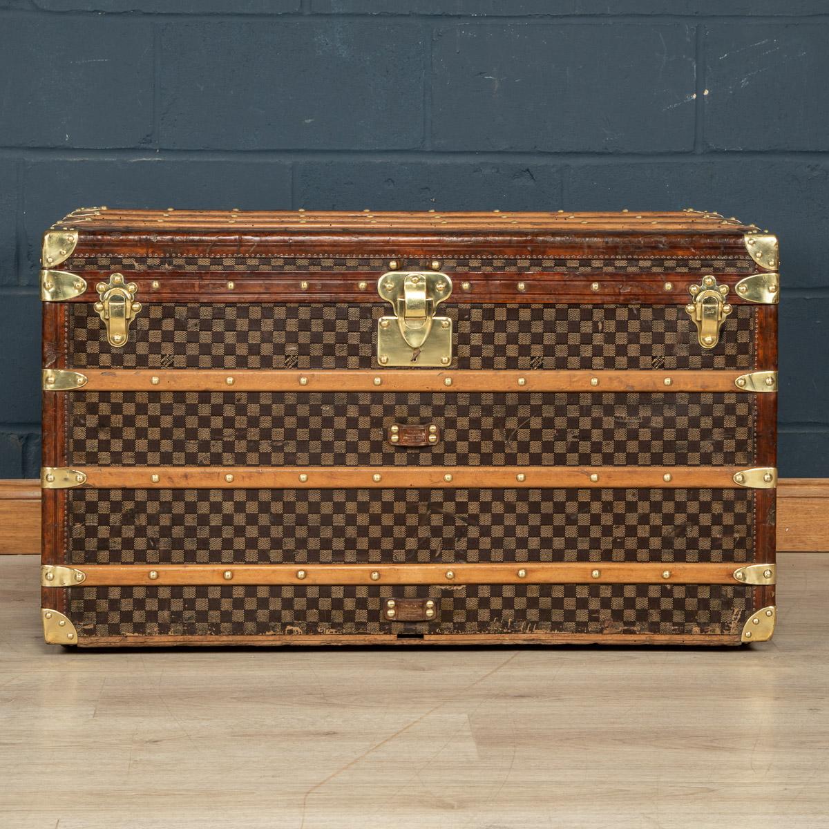One of the rarest Louis Vuitton trunks to be offered, this trunk is covered in the world famous damier (checkerboard) canvas. Dating to around 1900, it is a perfect example of such trunks. With its leather trim, brass studs, fittings and locks it