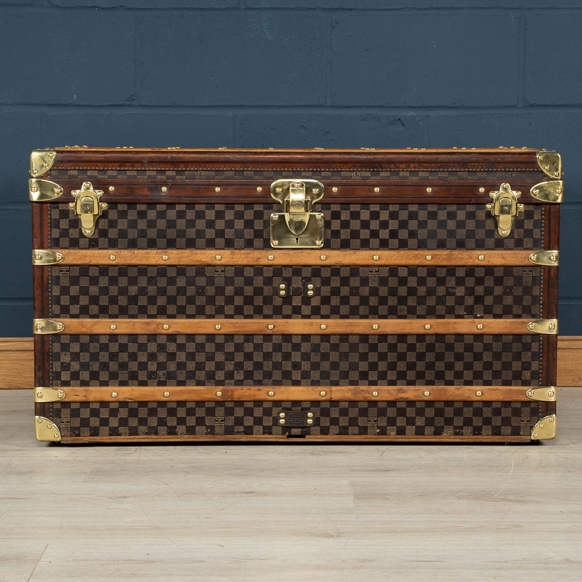 One of the rarest Louis Vuitton trunks to be offered, this trunk is covered in the world famous damier (checkerboard) canvas. Dating to circa 1900, it is a perfect example of such trunks. With its leather trim, brass studs, fittings and locks it