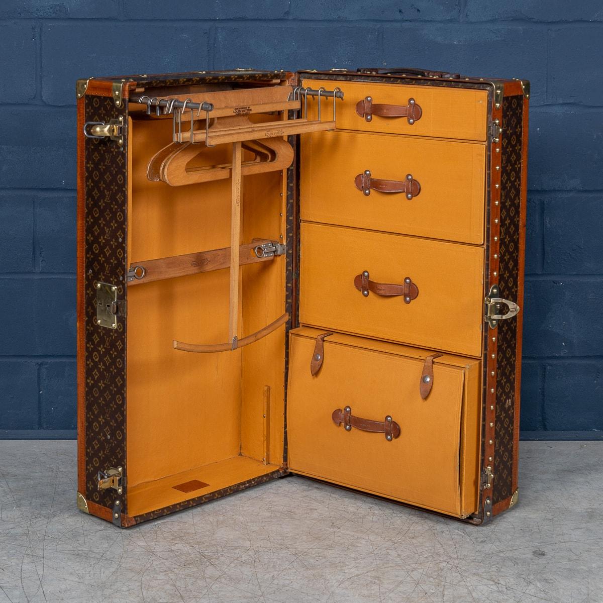 A stunning and rare sized early 20th century Louis Vuitton wardrobe trunk covered in the world famous LV monogrammed canvas. With its lozine borders and brass fittings it would have been the top of the line even at the time of purchase some 100