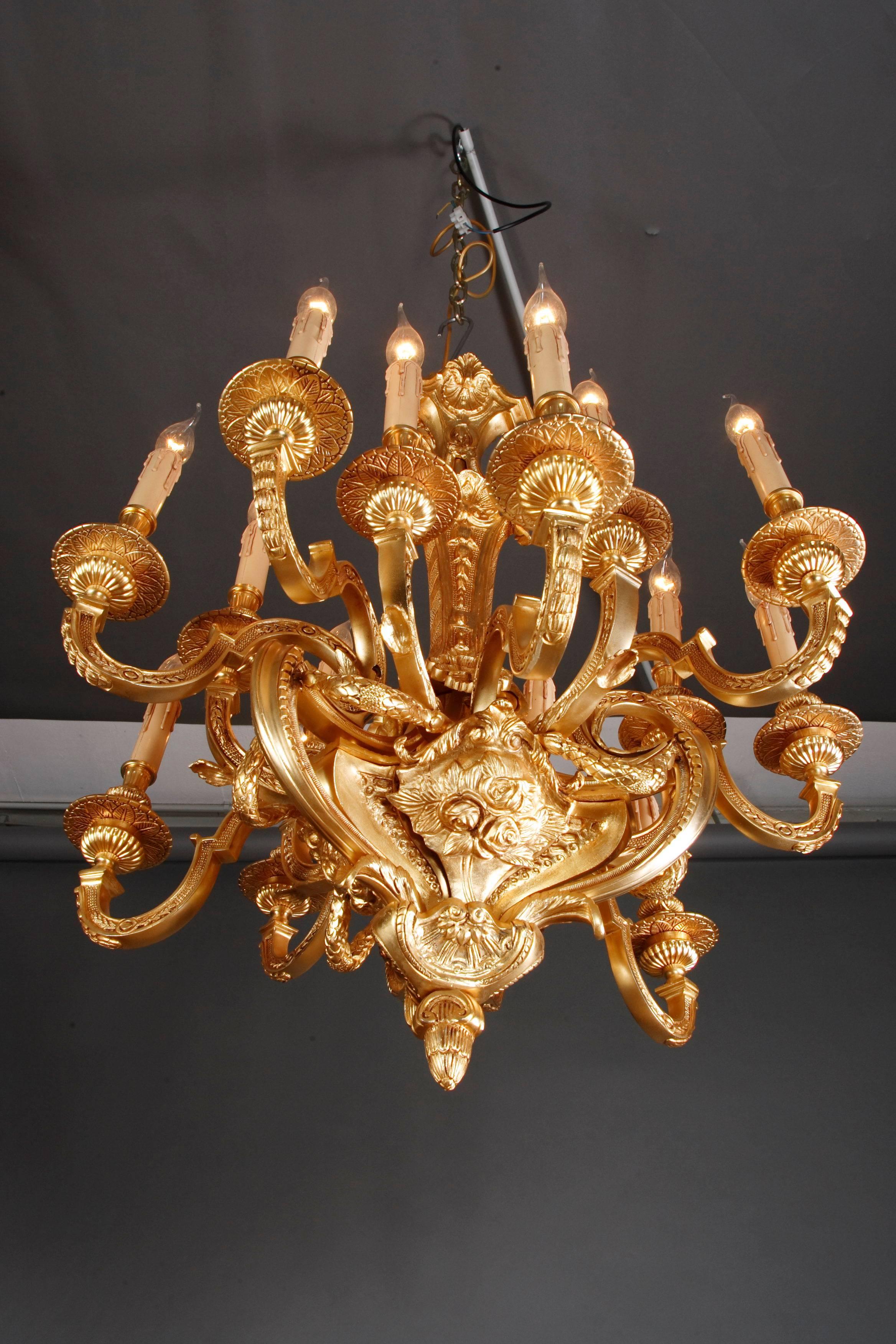 20th century Louis XIV ceiling candelabra/ chandelier 
Ceiling candelabra in Louis XIV style.
Solid, engraved brass. Fifteen curved light arms.

Delivery time can take about 6-8 weeks

(F-Kan-1).