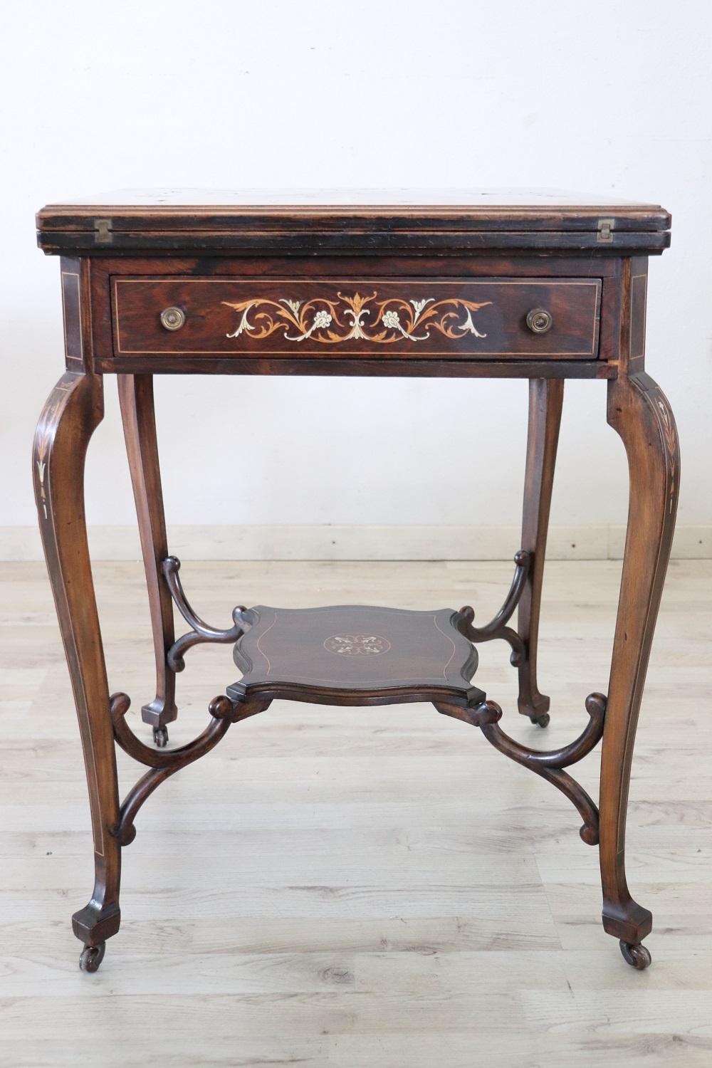 Rare and fine quality Louis XV style 1940s game table in inlay walnut, the legs are long and slender. The decoration is on each side so you can place the tables also in the centre of the room. Made with precious inlay wood. The decorations are of