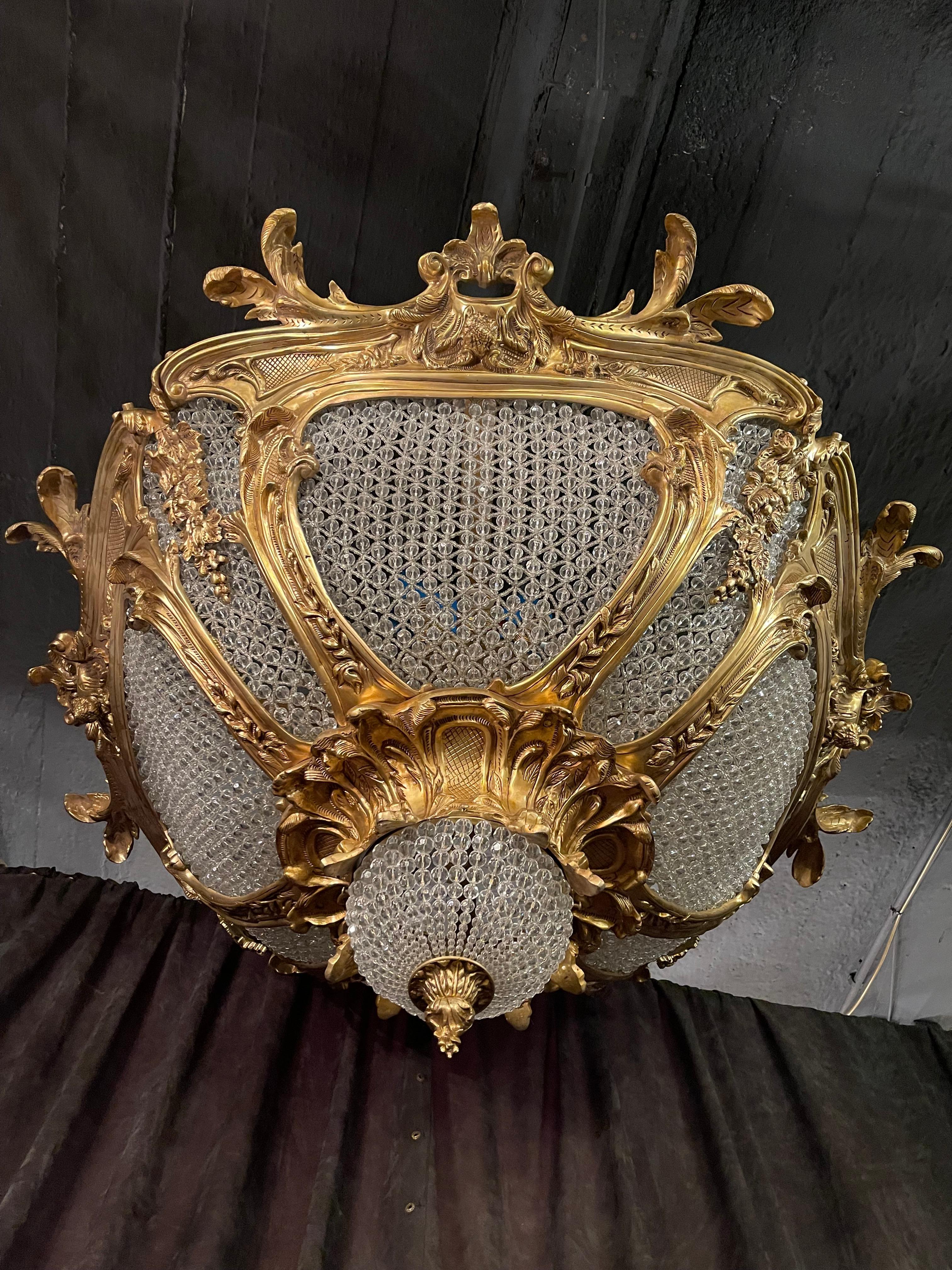 Monumental highly significant candelabra in Louis XV style.
Unusual, finely engraved and cast bronze. Balustrade formed, profile-framed corpus connected with wide, ornamental reliefed, hoops, crowned by sunbeams. On the wide hoop, can be found