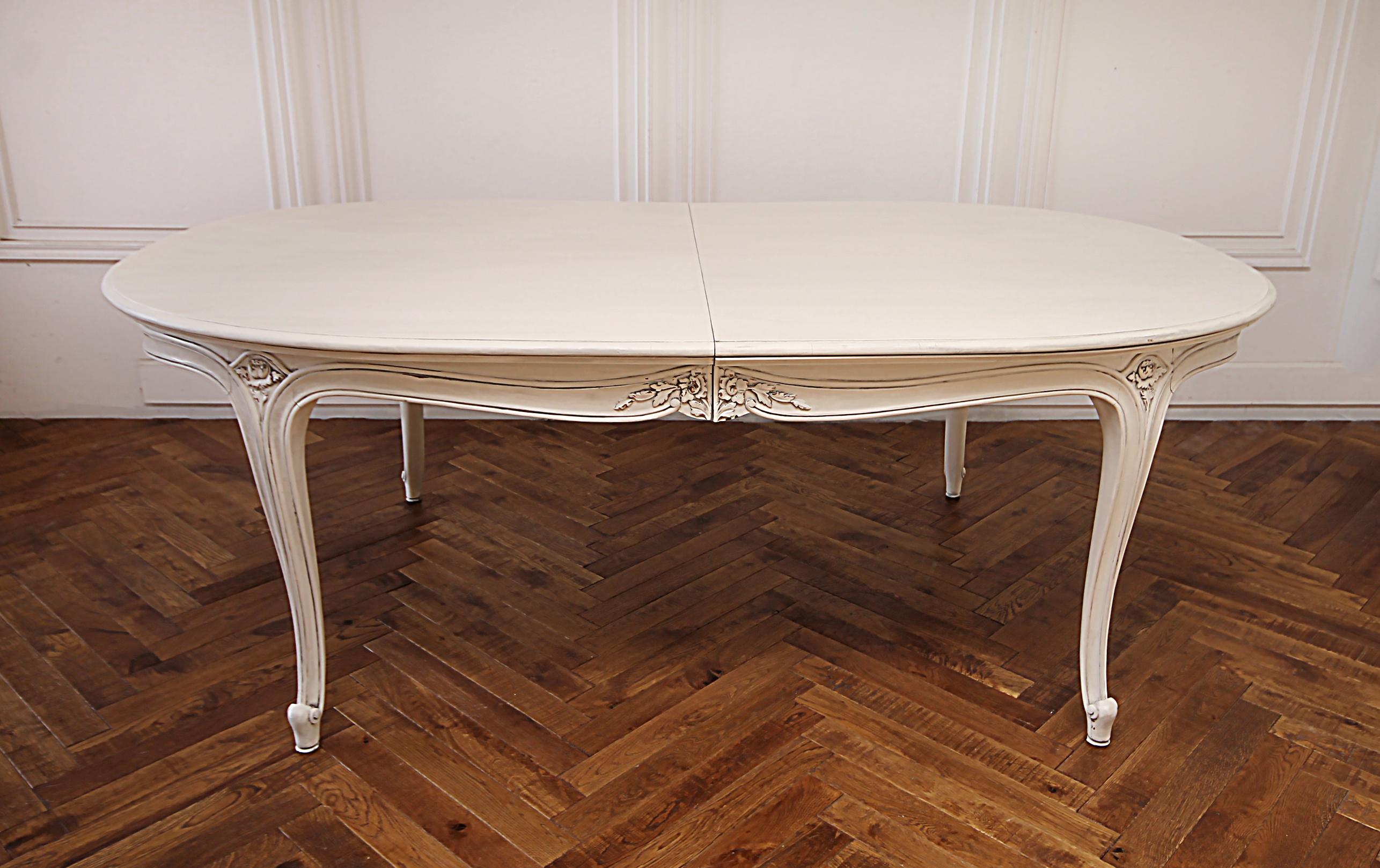 20th century Louis XV Style painted dining table with leaves
Painted in our oyster white finish with subtle distressed edges and finished with an antique patina. The dining table has 2 leaves with finished aprons so the decorative sides are