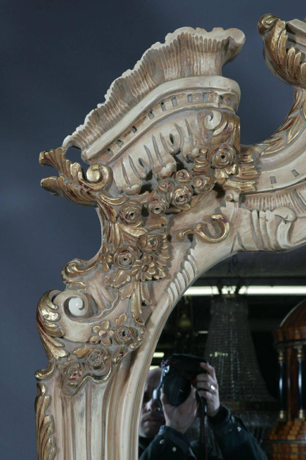 20th Century Louis XV style standing mirror
Monumental astrocratic standing mirror in Louis XV style
Solid beechwood, finely carved, colored hand-painted and gilded. Elaborately carved and strongly curved frame closure. Rich gable-styled broken