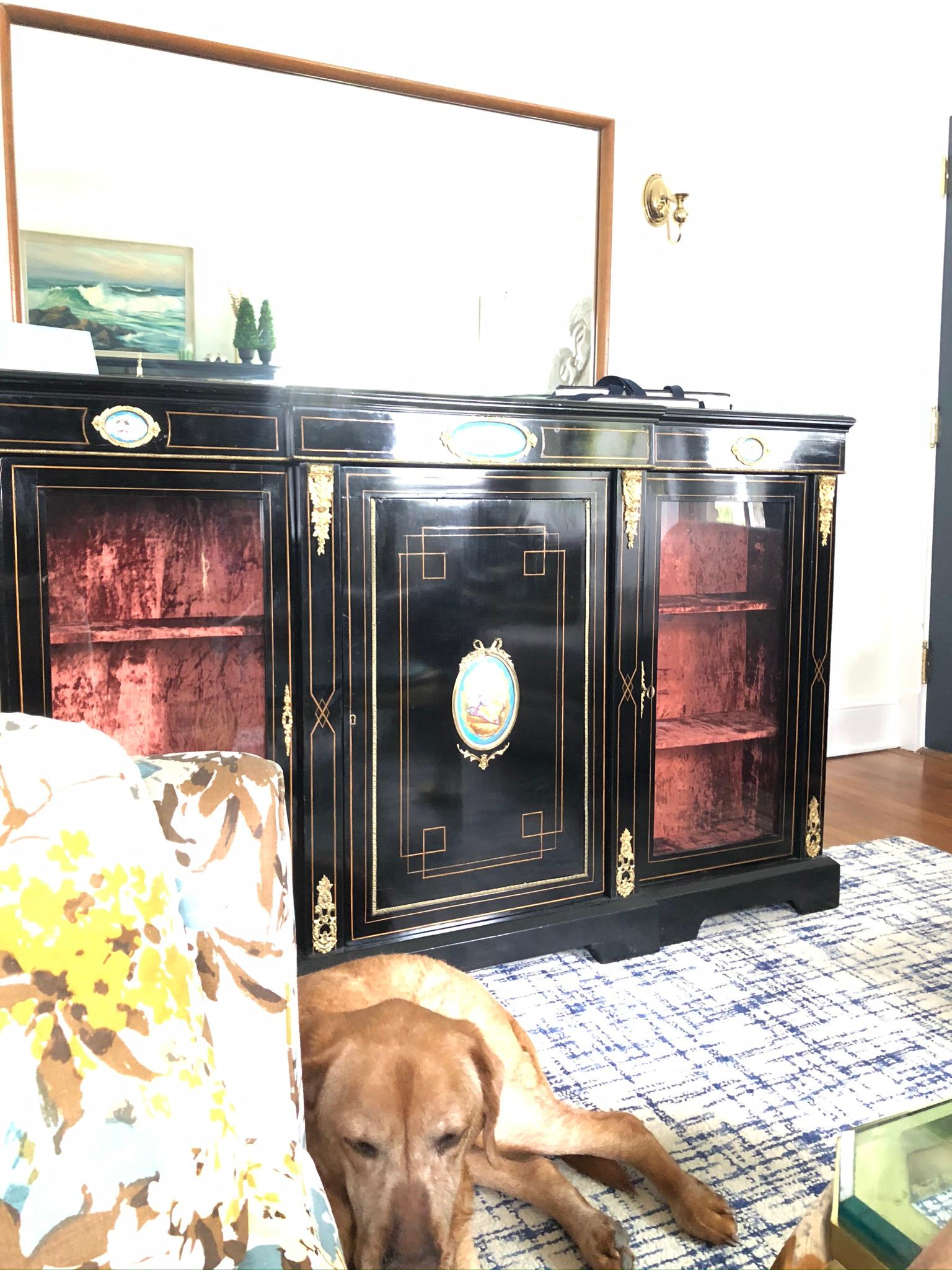 Stunning example of neoclassical display cabinet or bookcase. Velvet lined shelves. Wonderful ormolu detail along with enamel painted scenes. Label.