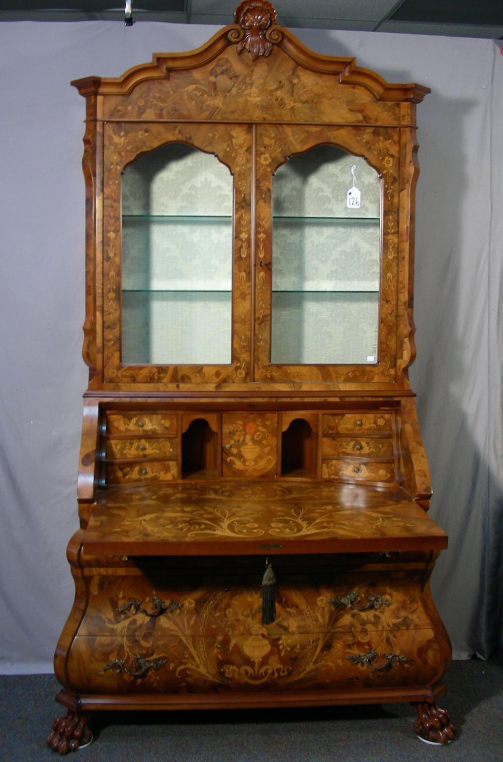 20th Century Louis XVI Style Italian Inlaid Secretary. Lower portion with four drawers. Center section with drop-front which reveals writing area and six small drawers and pigeon holes for storage. Upper display area with two doors and two glass