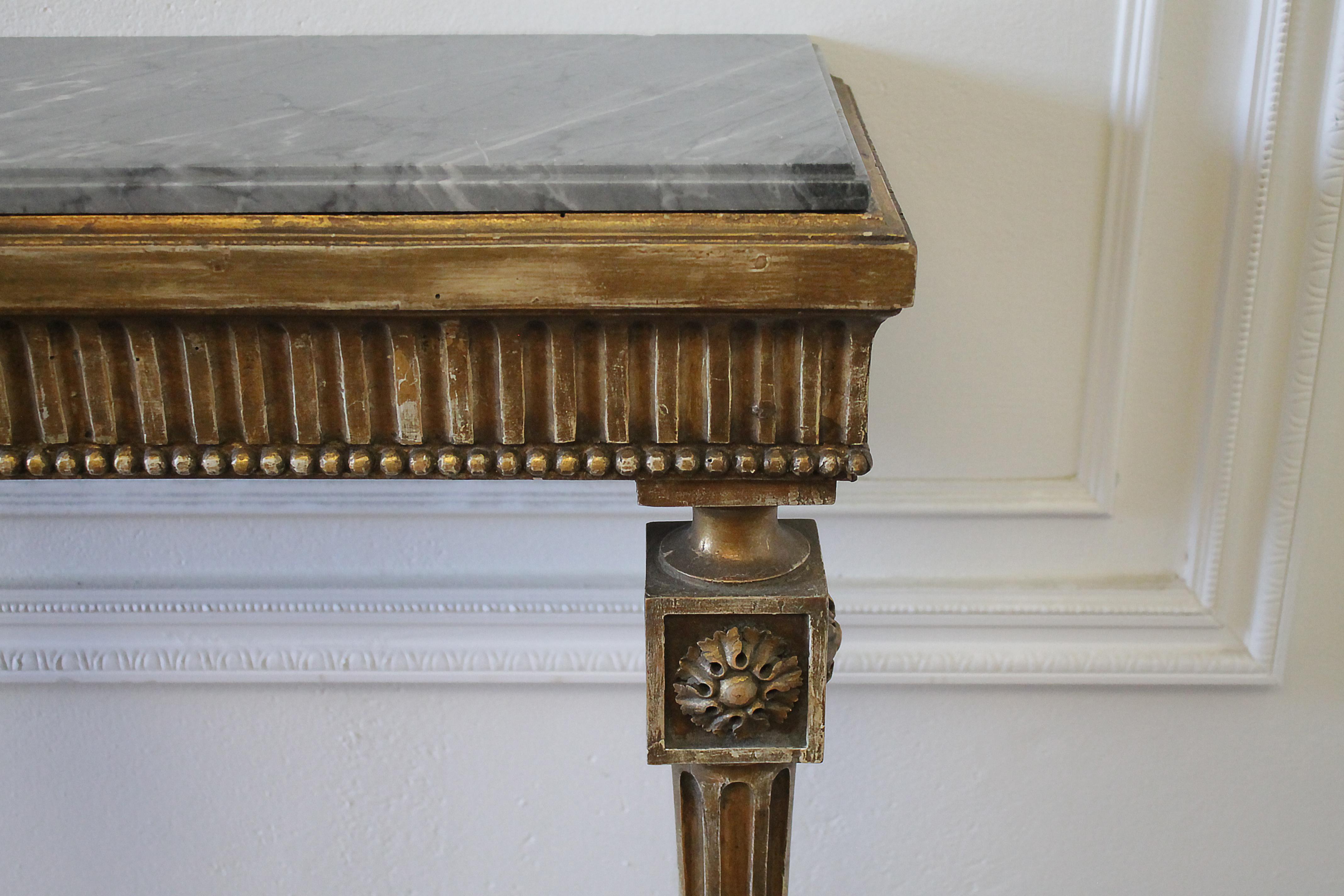 20th century petite Gilt Wood wall console table with stone top
Original finish with beautiful faded gilt patina. Easily attached to the wall, legs are sturdy.
Measures: 18.75