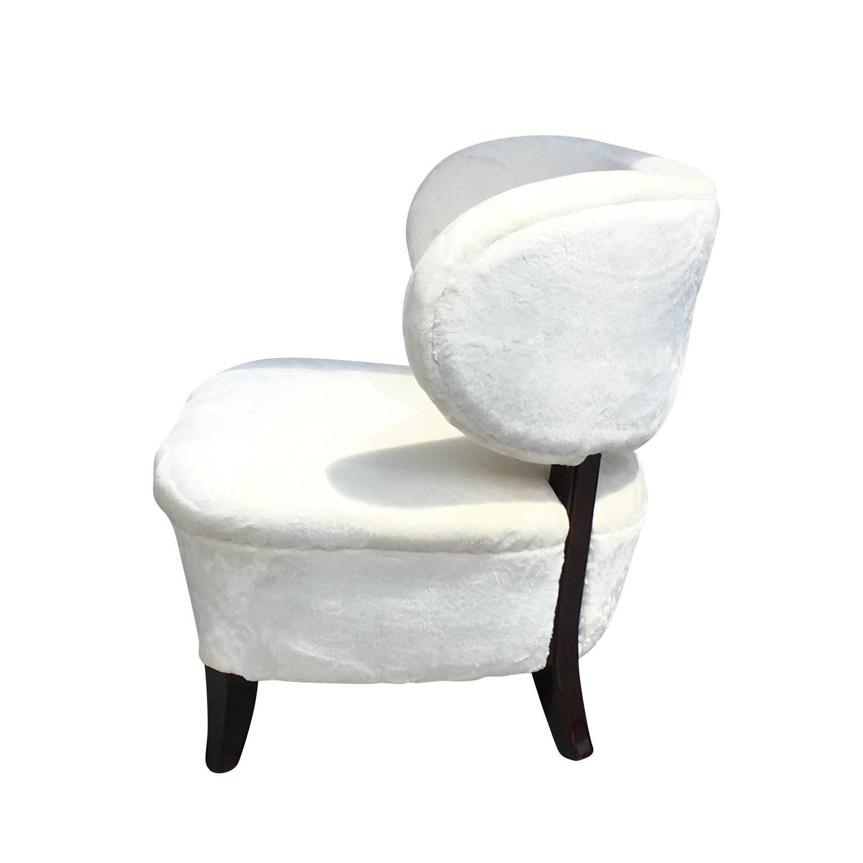 A vintage Swedish Art Deco lounge chair in good condition, designed by Otto Schulz. Features a curved back, studs, mahogany legs and has been reupholstered in a white Pierre Frey fabric. Wear consistent with age and use, circa 1930, Sweden,