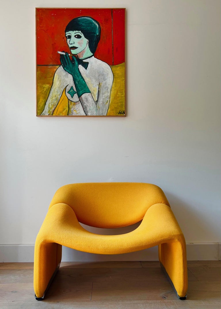 Iconic chair 'Groovy' by french designer Pierre Paulin for the dutch Artifort, 1970's. An imposing chair not only by its size but mostly by its sculptural lines: a true modernist statement in yellow-orange fabric.
 
Pierre Paulin (1927-2009) made a