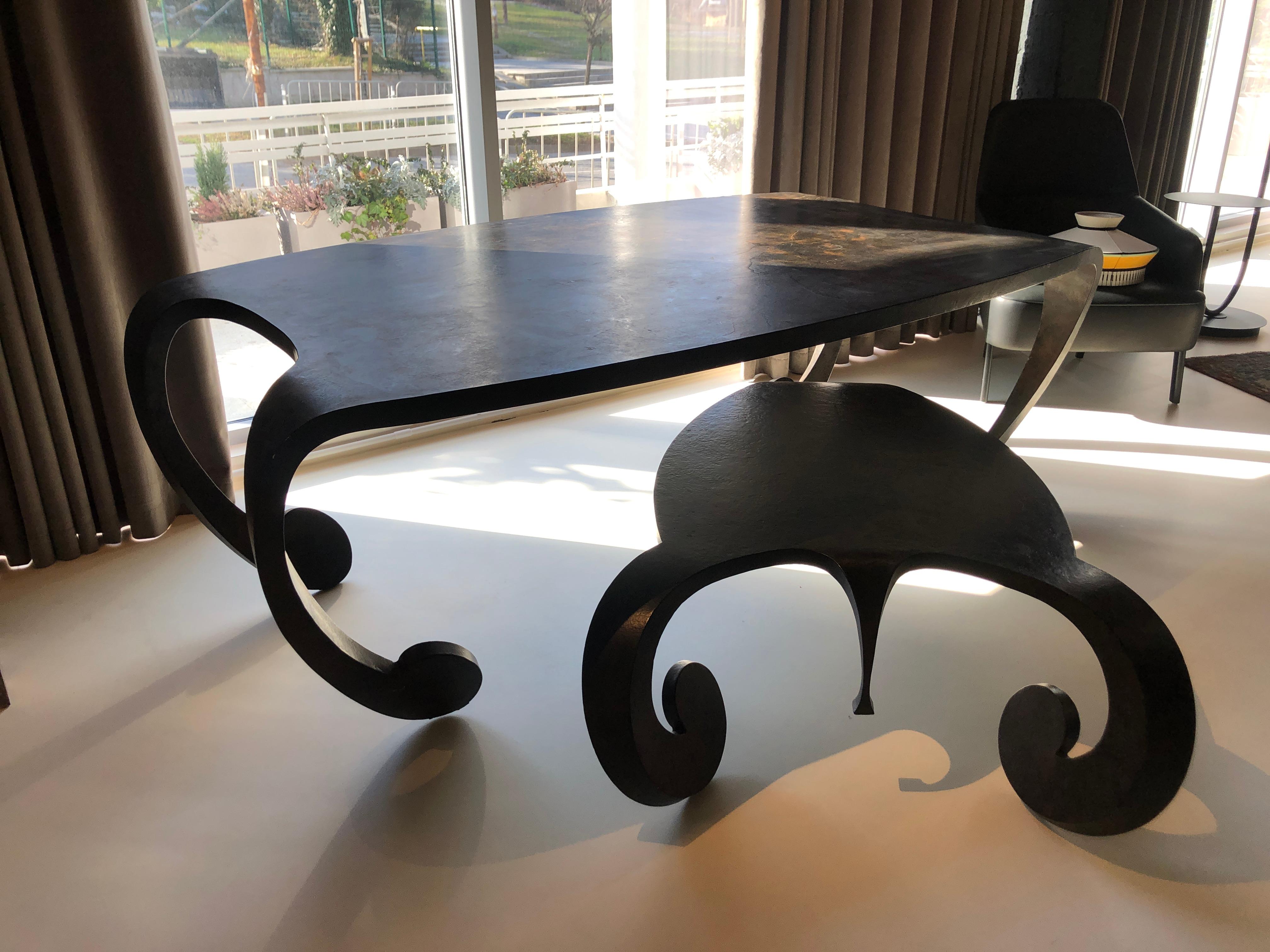 Extraordinary low table made of folded and welded metal in original color.
The model is called 