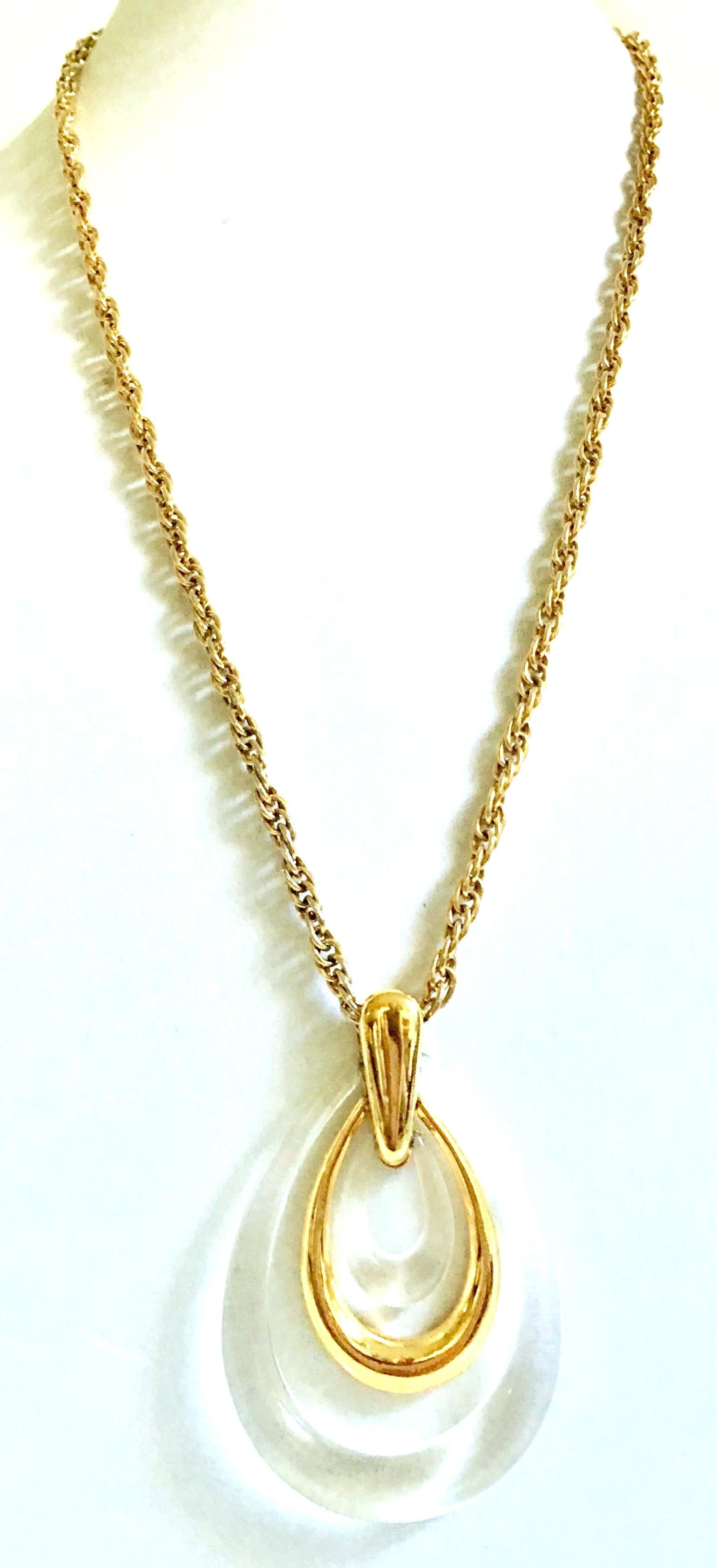 20th Century Gold & Translucent Lucite Articulating Teardrop Pendant Necklace by, Trifari. This Trifari signed piece features a gold plate chain with a 3.13
